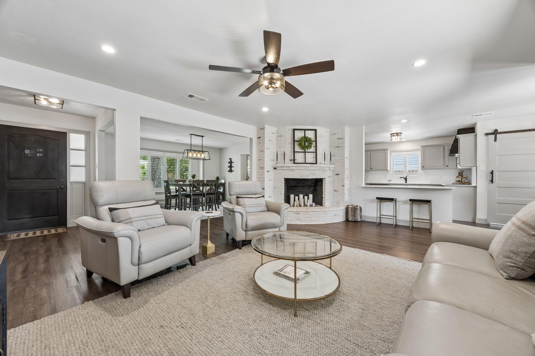 Image 2: Open concept living space to kitchen, dining room