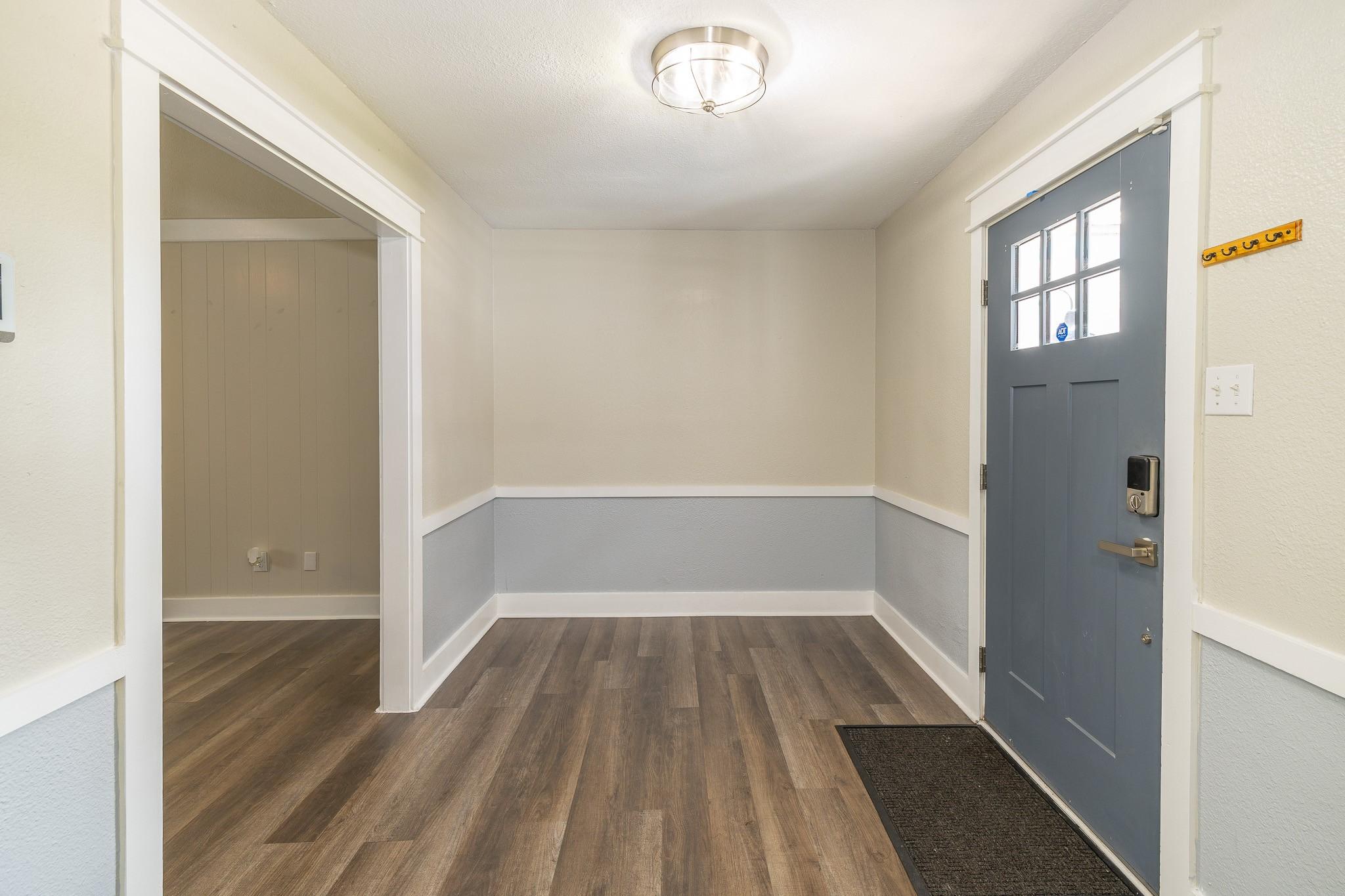 Image 4: The entrance to the home offers warm and inviting