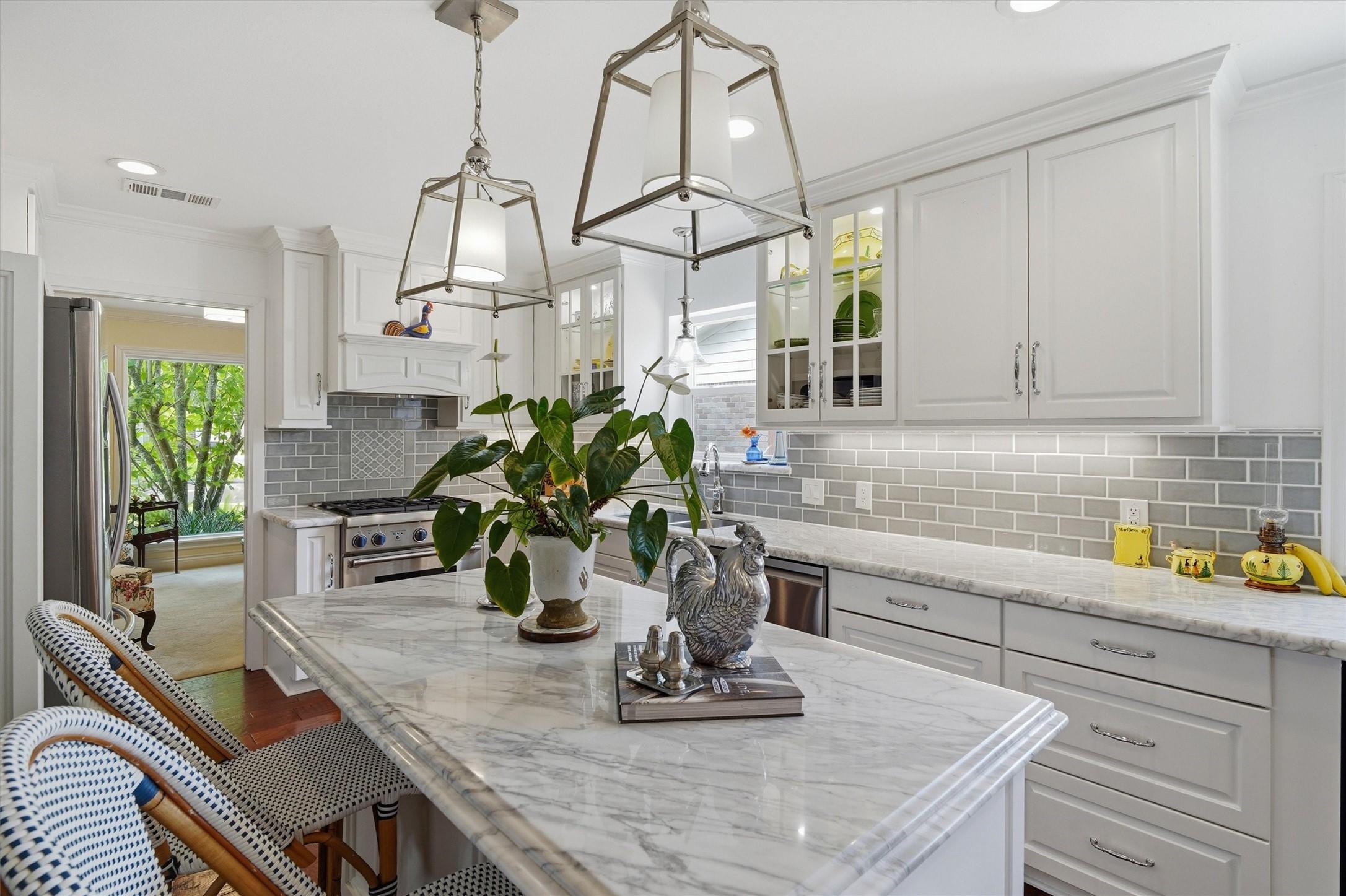 Image 2: Carrera marble countertops, handcrafted cabinetry,