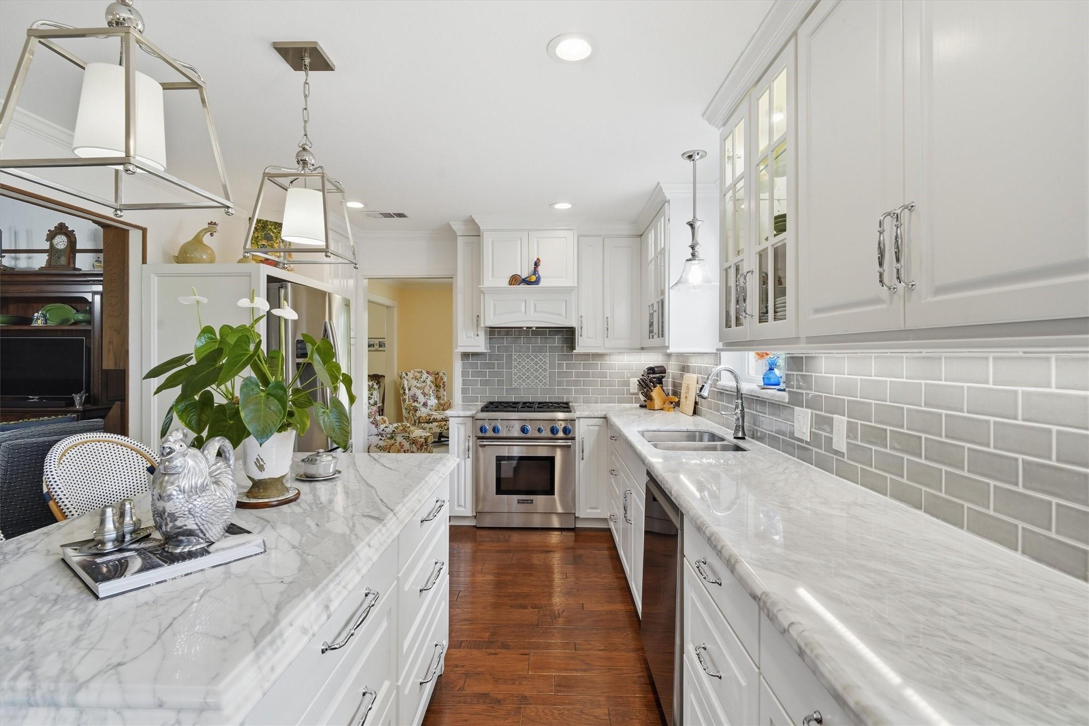 Image 4: Custom pull-out pantry storage to the right of the