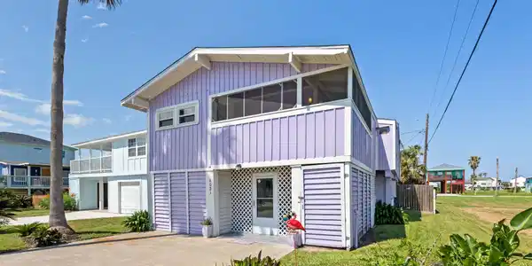 Image 4: The home boasts a double-wide driveway, a spacious