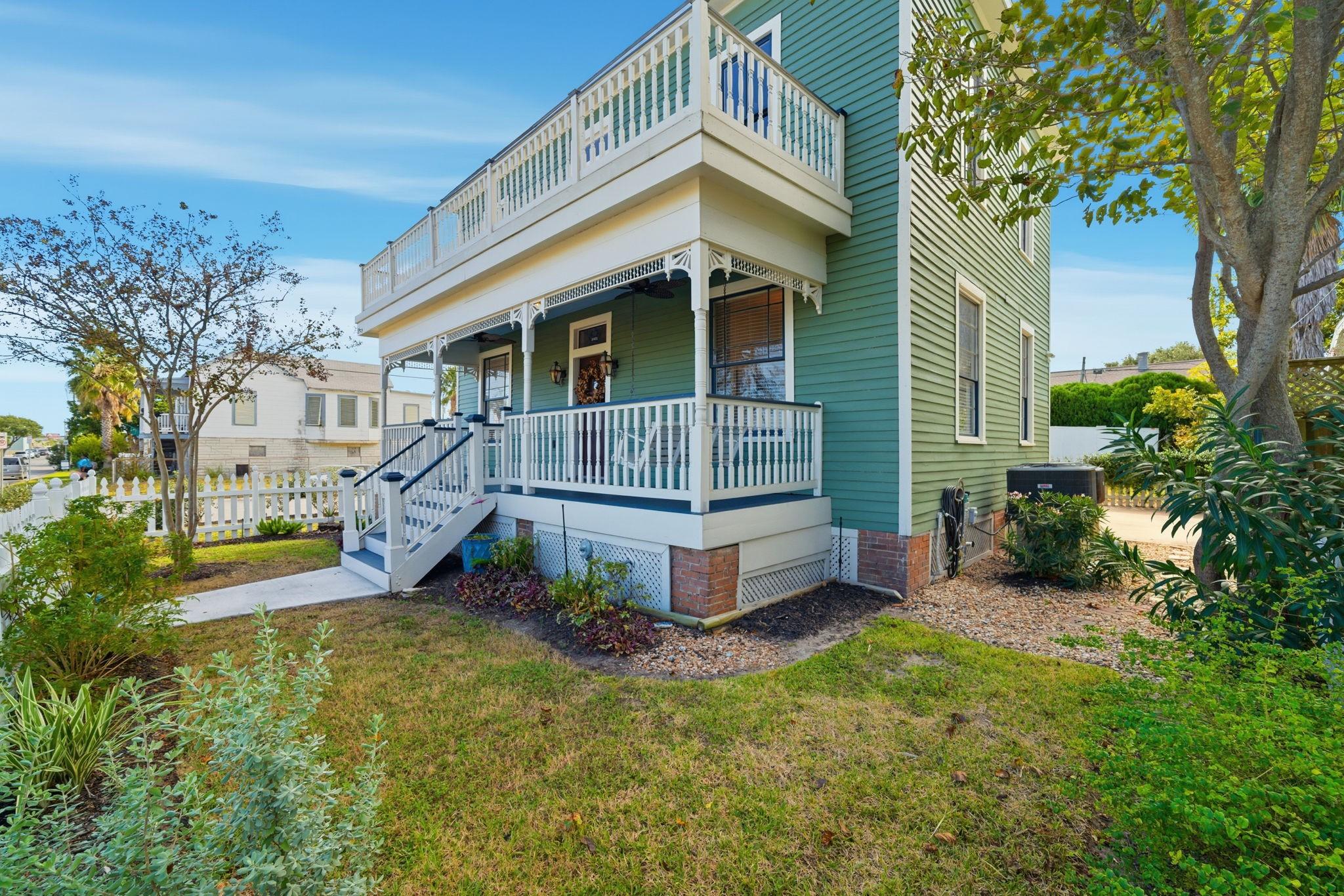 Image 4: This historic house includes a porch and two balco