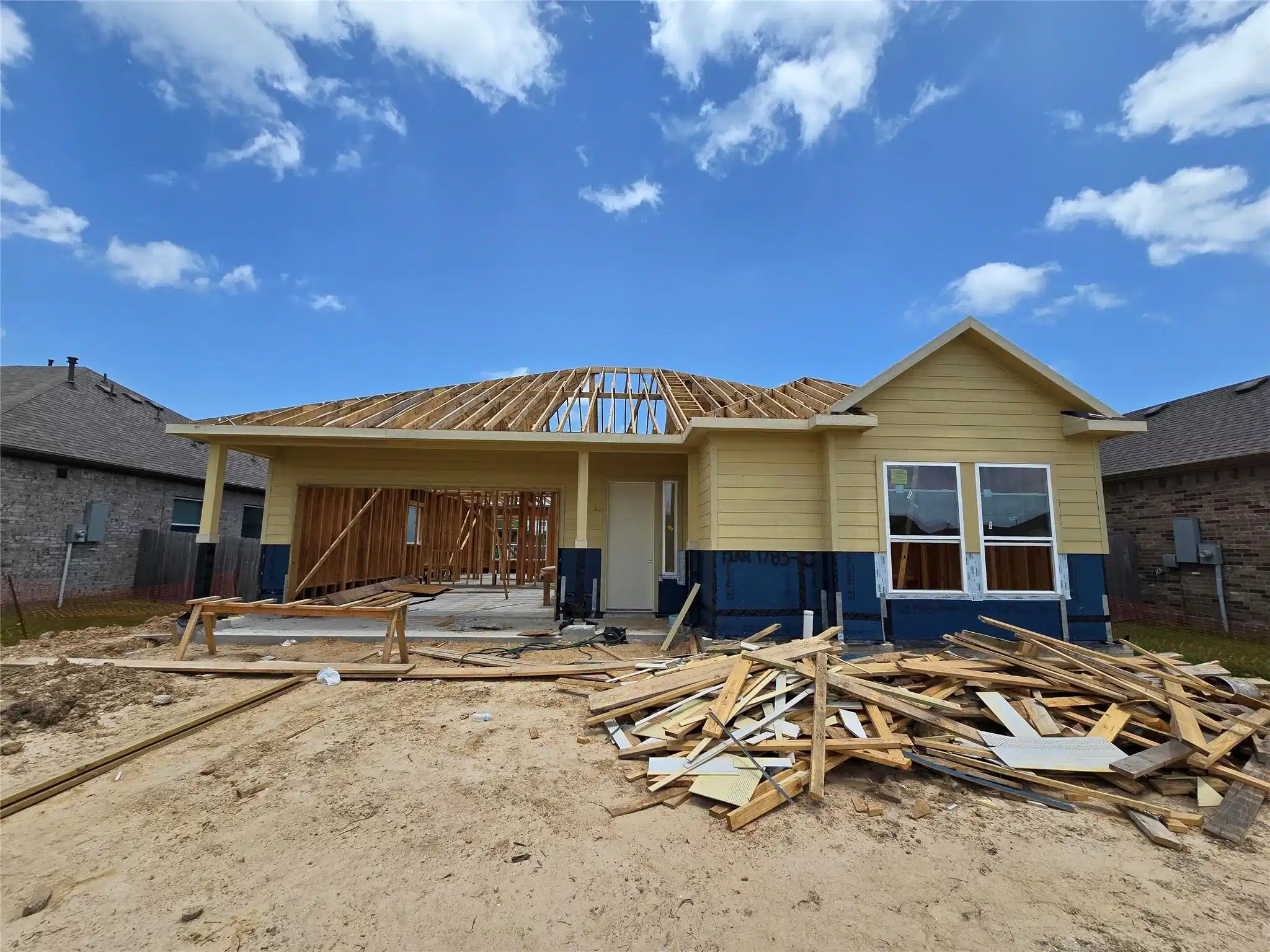 Image 1: Actual home under construction - roof is coming so