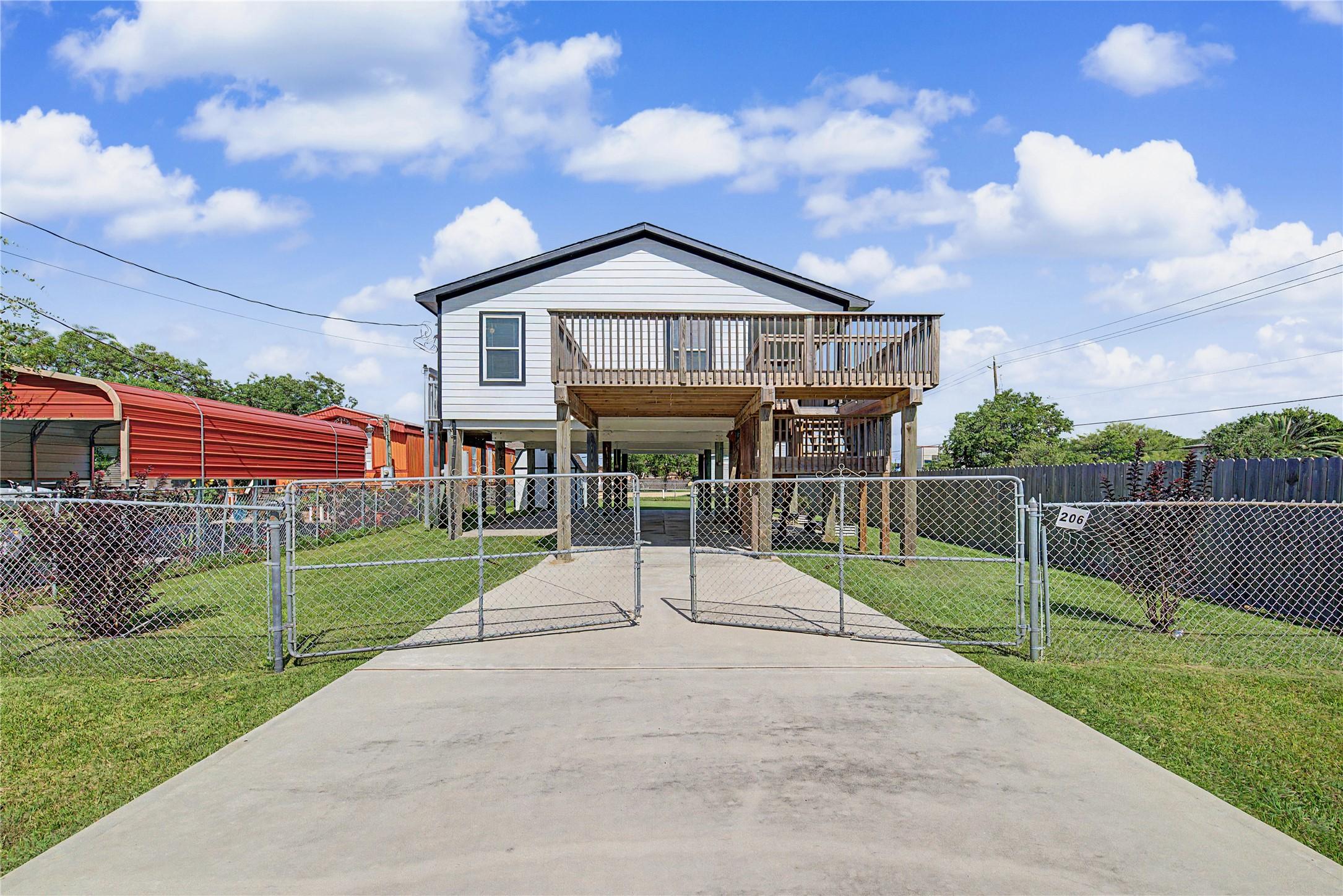 Image 3: Front of home from street (note it has two gates y