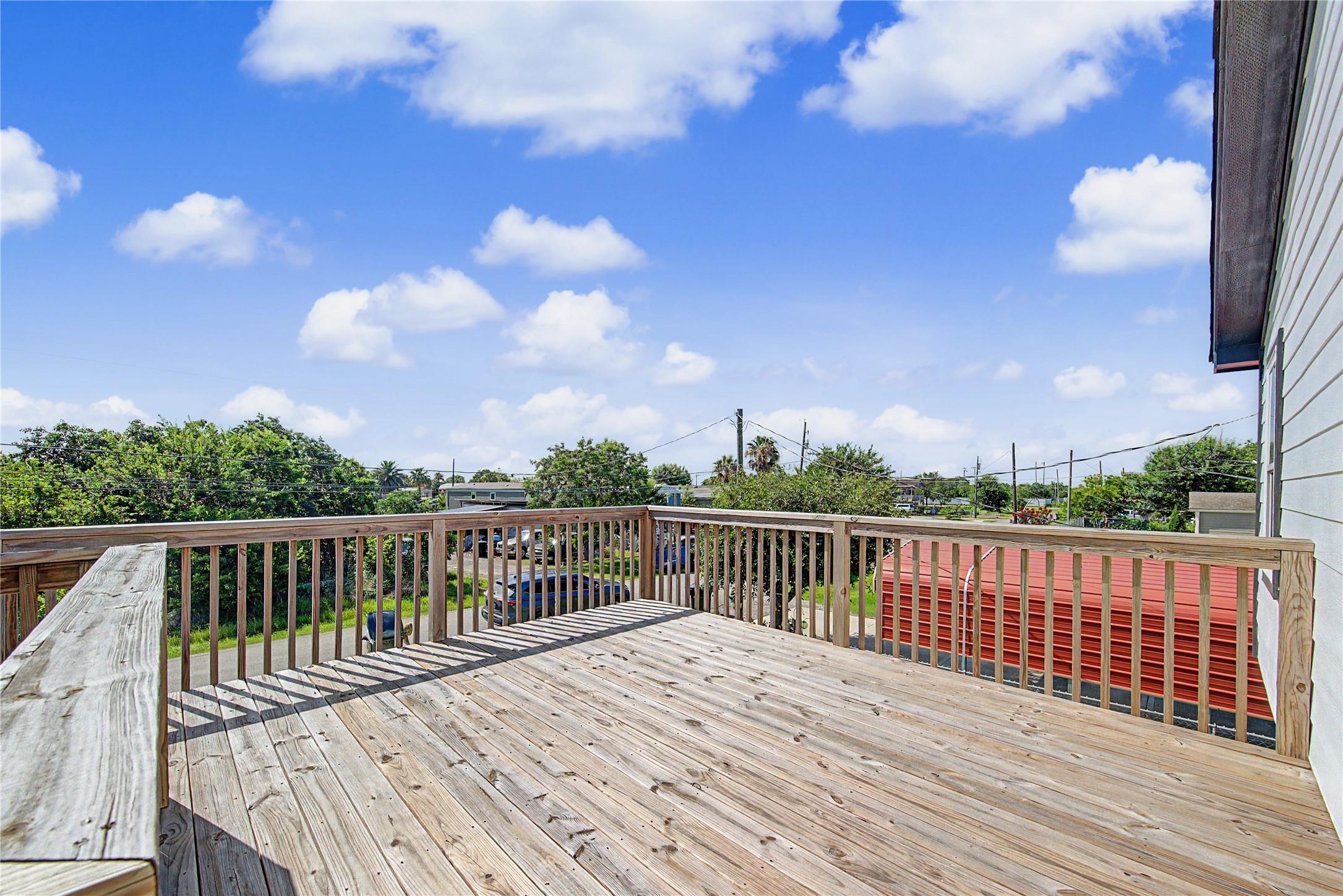 Image 4: Very large deck space at top of stairs before you
