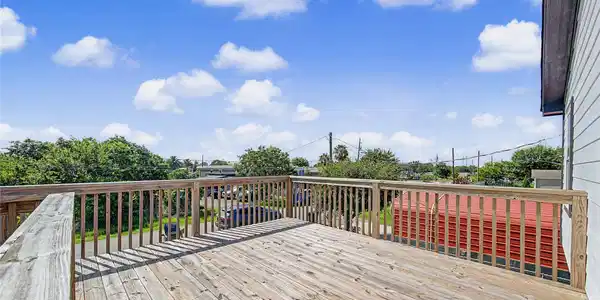 Image 4: Very large deck space at top of stairs before you