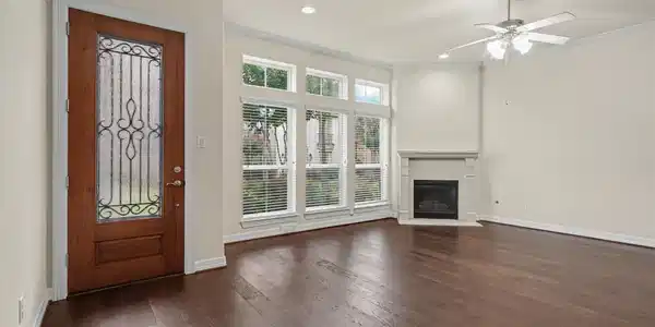 Image 3: Bright and inviting living room featuring a cozy g