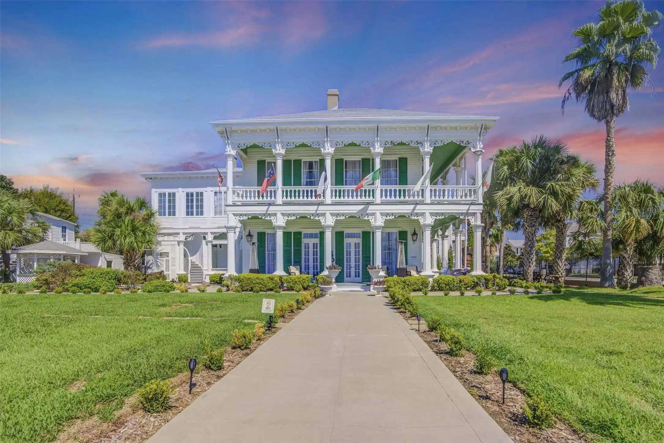 Image 1: Grand front exterior of George Manor showcasing it