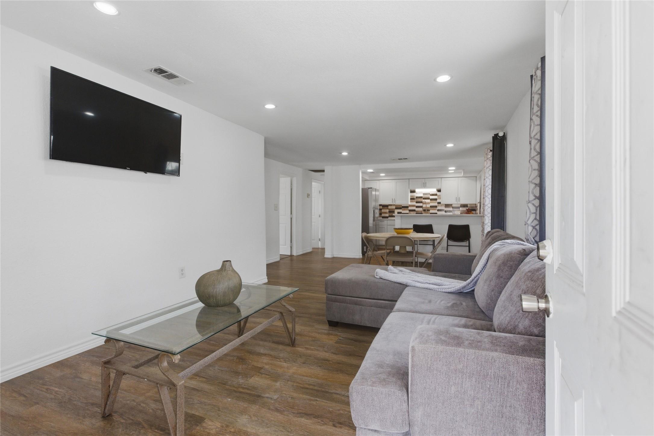 Image 3: The entry view leading into open living and kitch