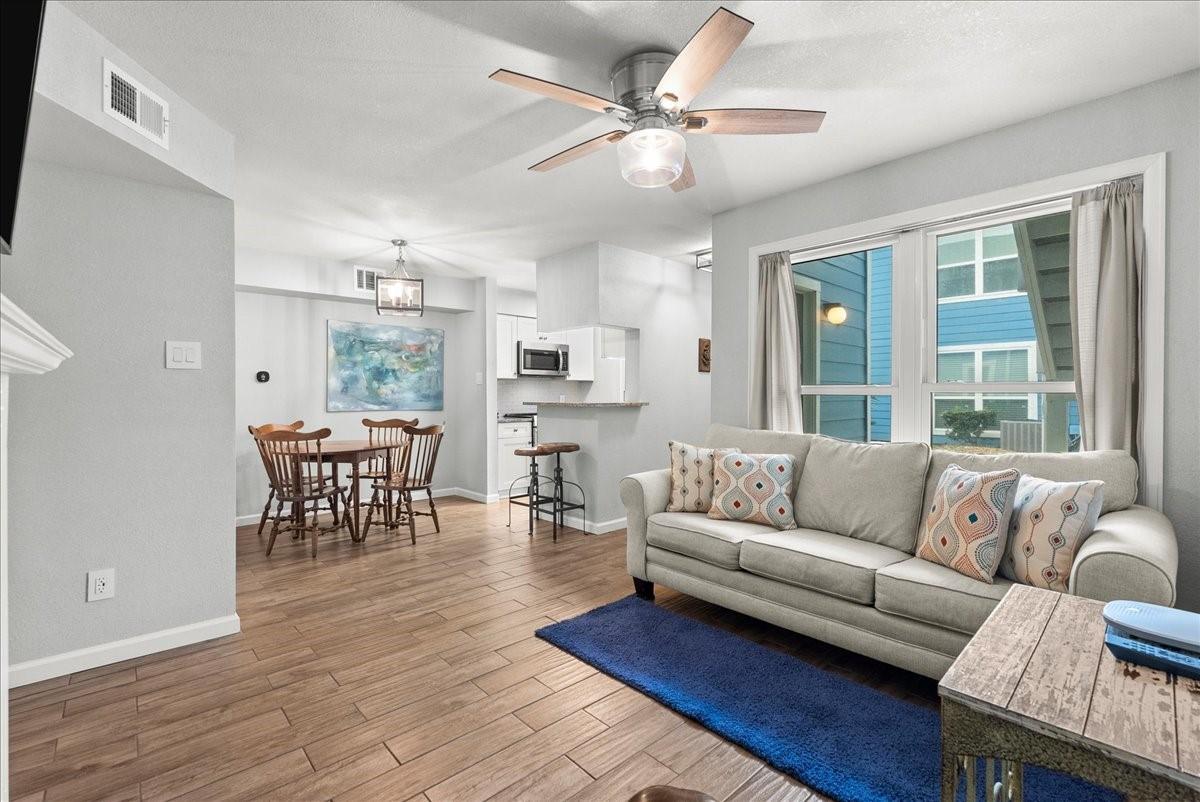 Image 3: Fully updated! Enjoy new tile floors, beautiful li