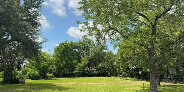 Image 2: Well-maintained vacant lot, boasting 81 feet of fr