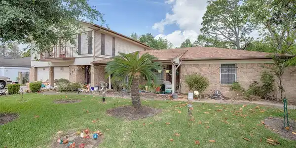 Image 2: The lush landscaping gives this home great curb ap