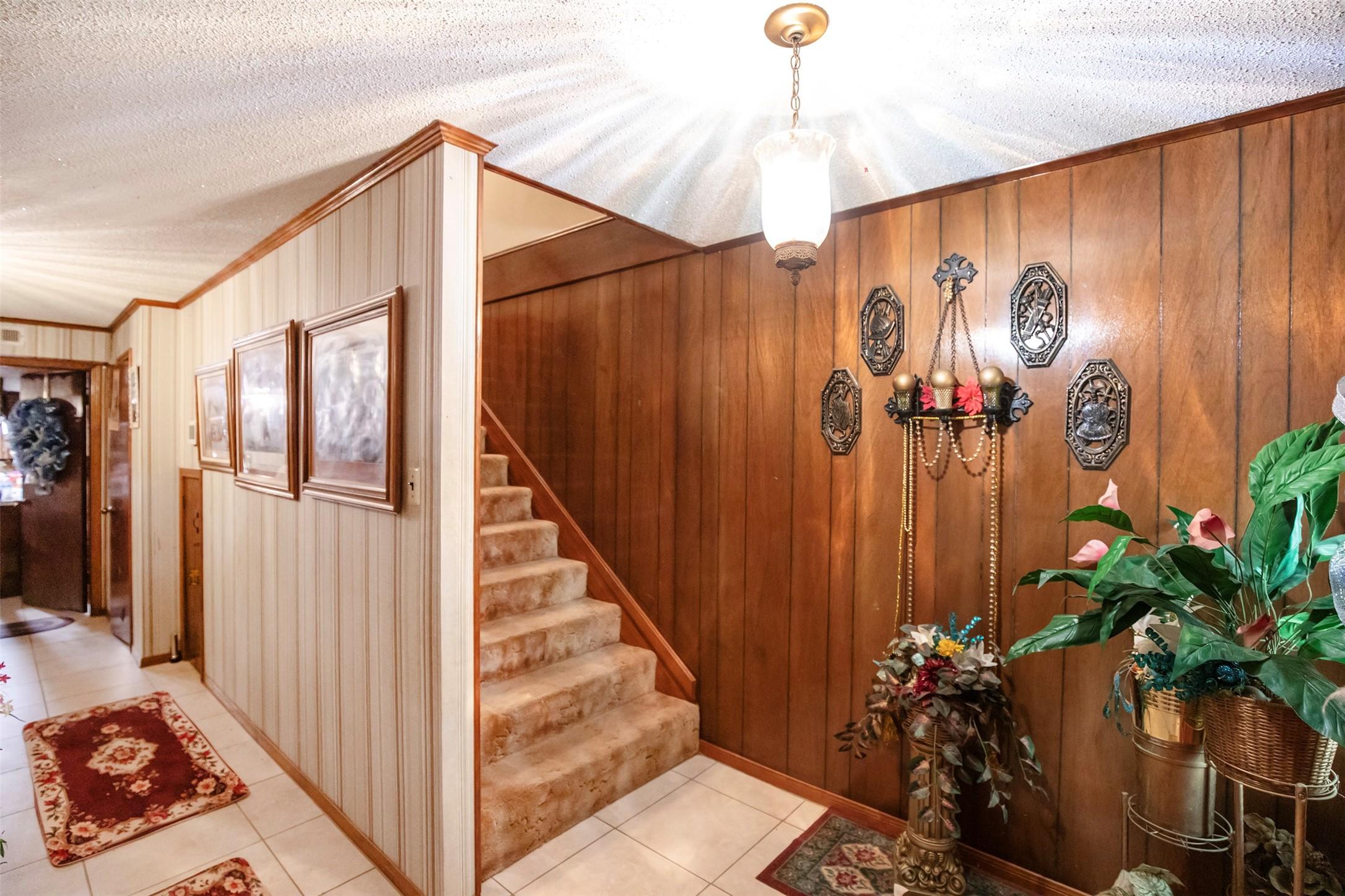 Image 3: The entryway features tile flooring with beautiful
