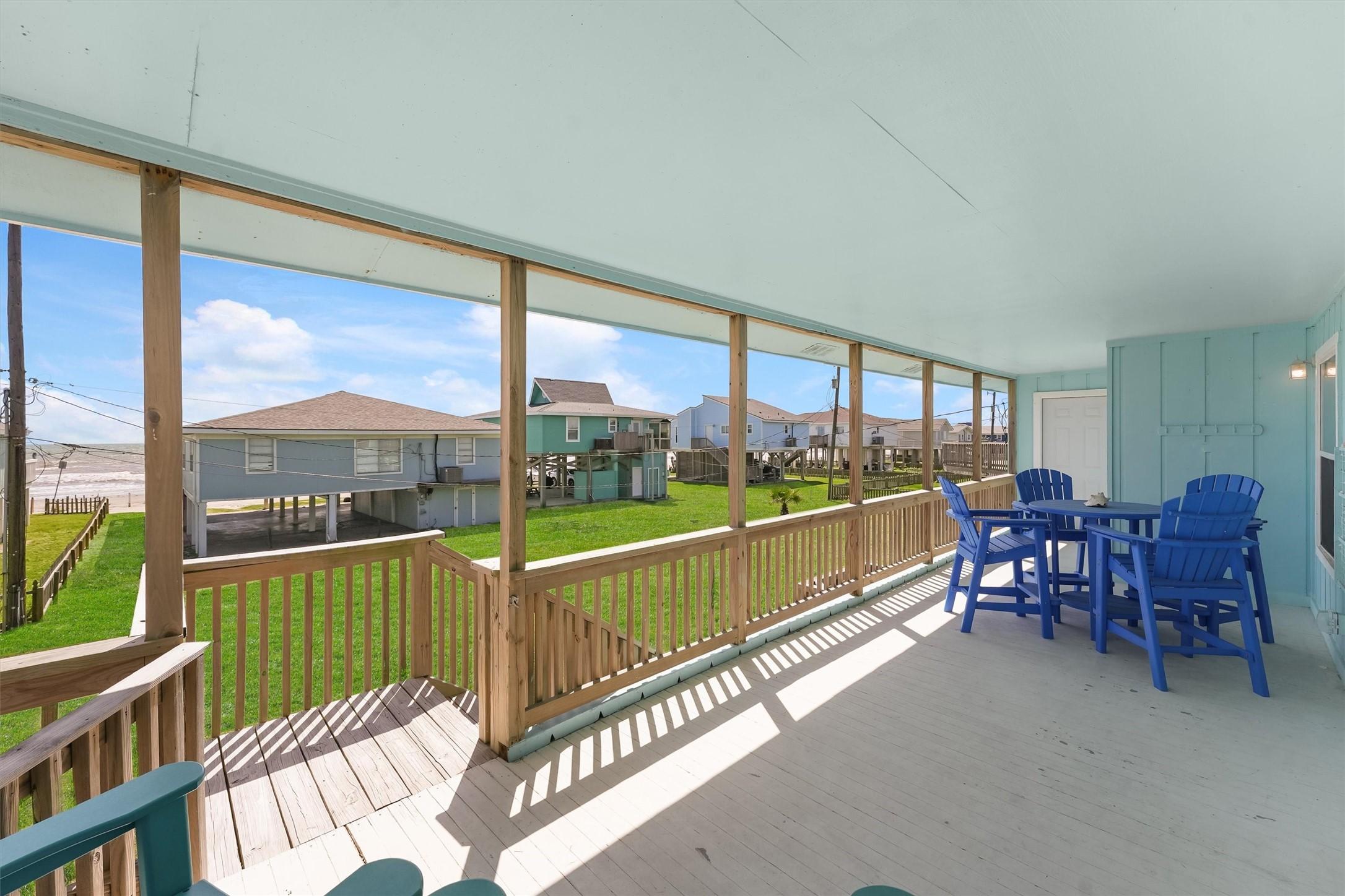 Image 4: Unwind on the expansive covered patio, where the s
