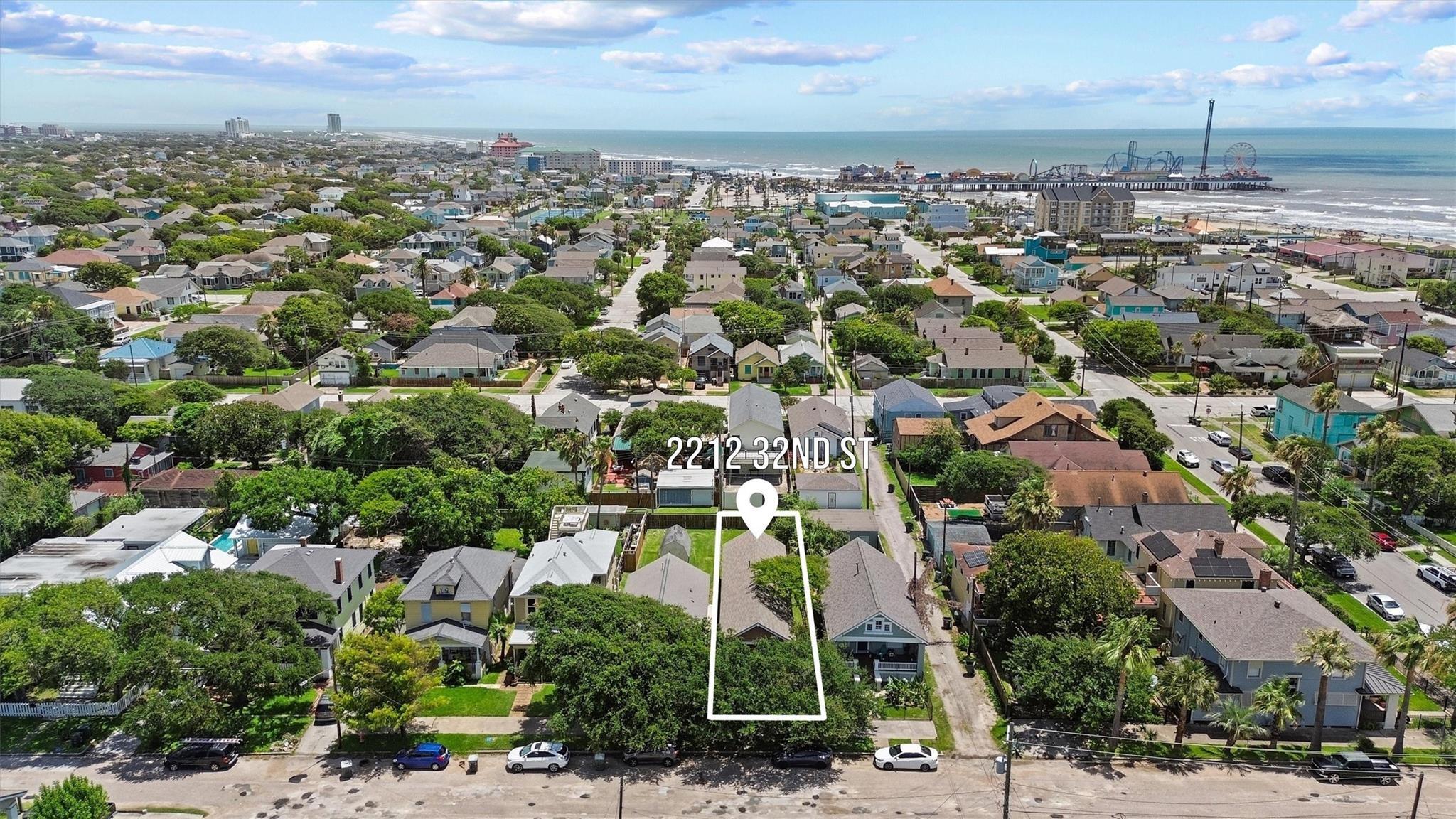 Image 2: This aerial photo showcases a charming home locate