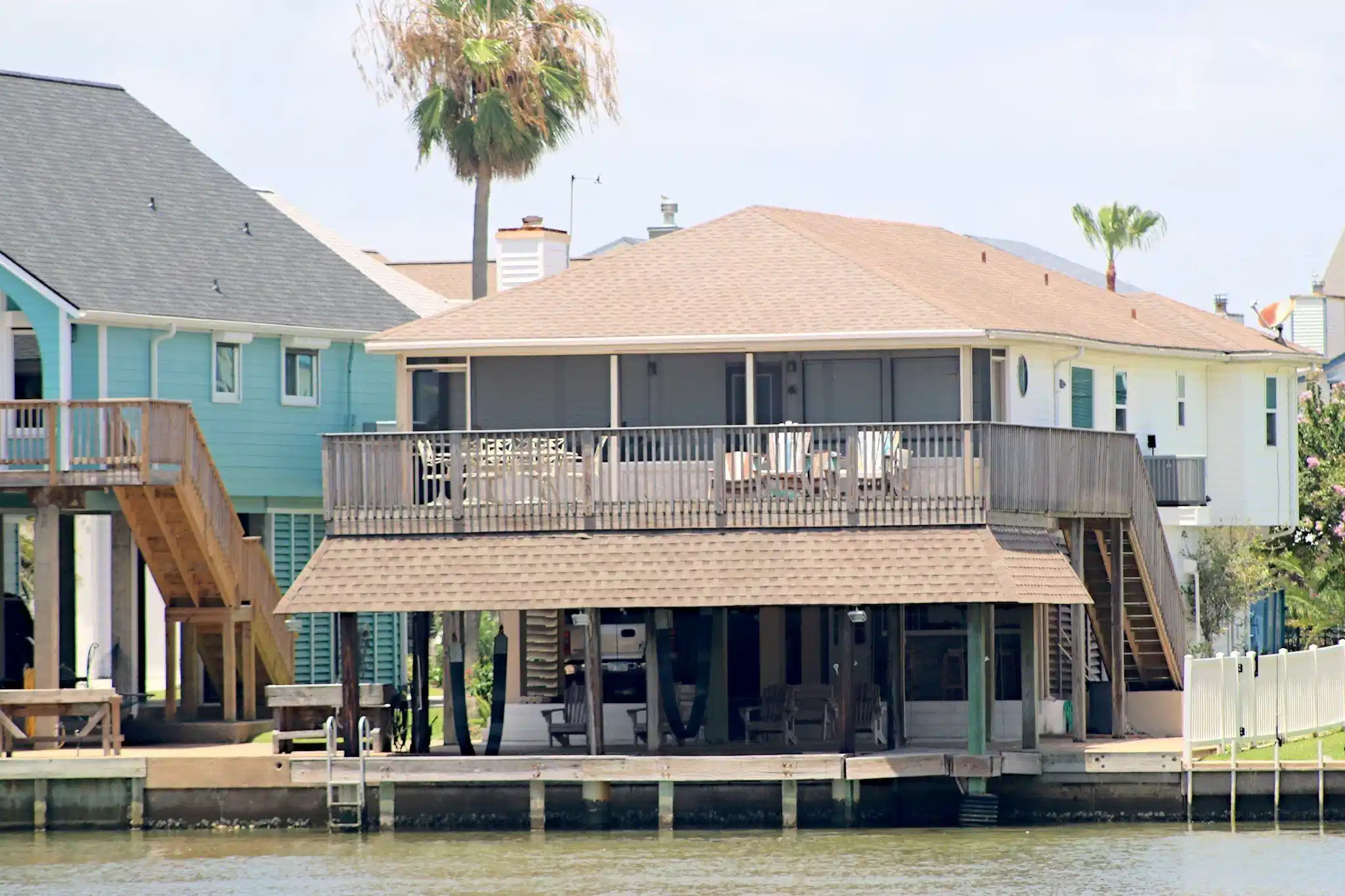 Image 1: A view from the canal featuring multiple decks wit