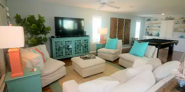 Image 4: Living area is inviting from entry.