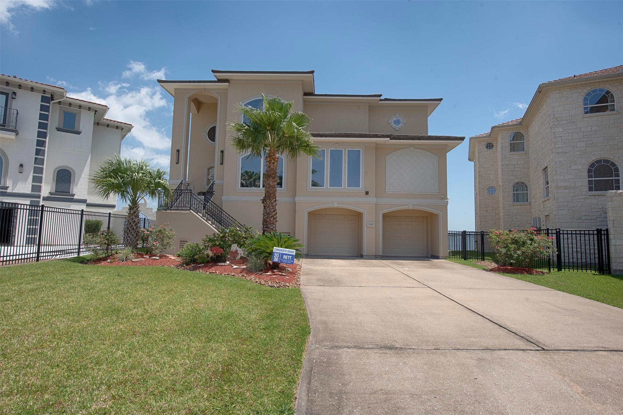 Image 3: A ground view of the home showing the stunning arc
