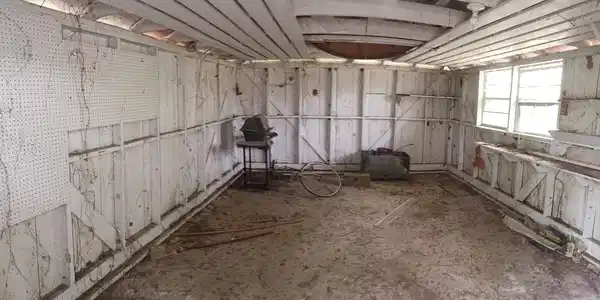 Image 2: Inside of small shed on property.
