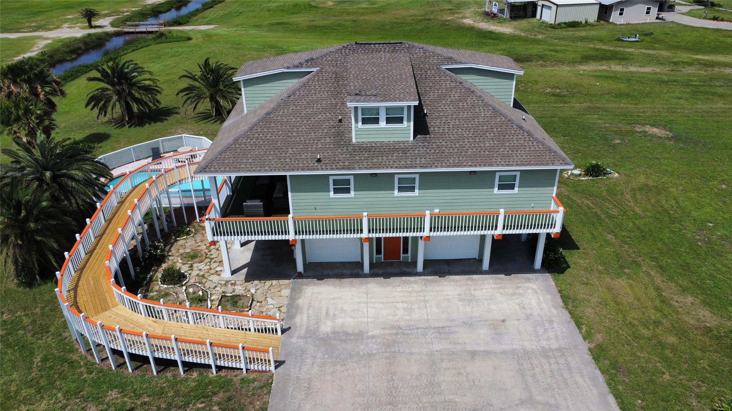 Image 4: Aerial view of the home from the East