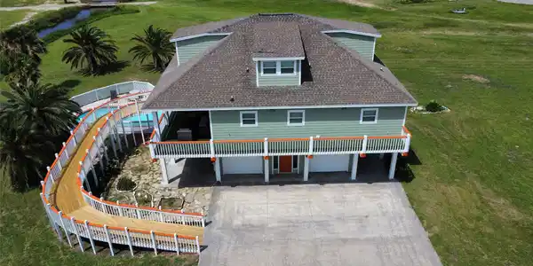 Image 4: Aerial view of the home from the East