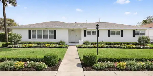 Image 2: Virtually Staged front of home with landscaping