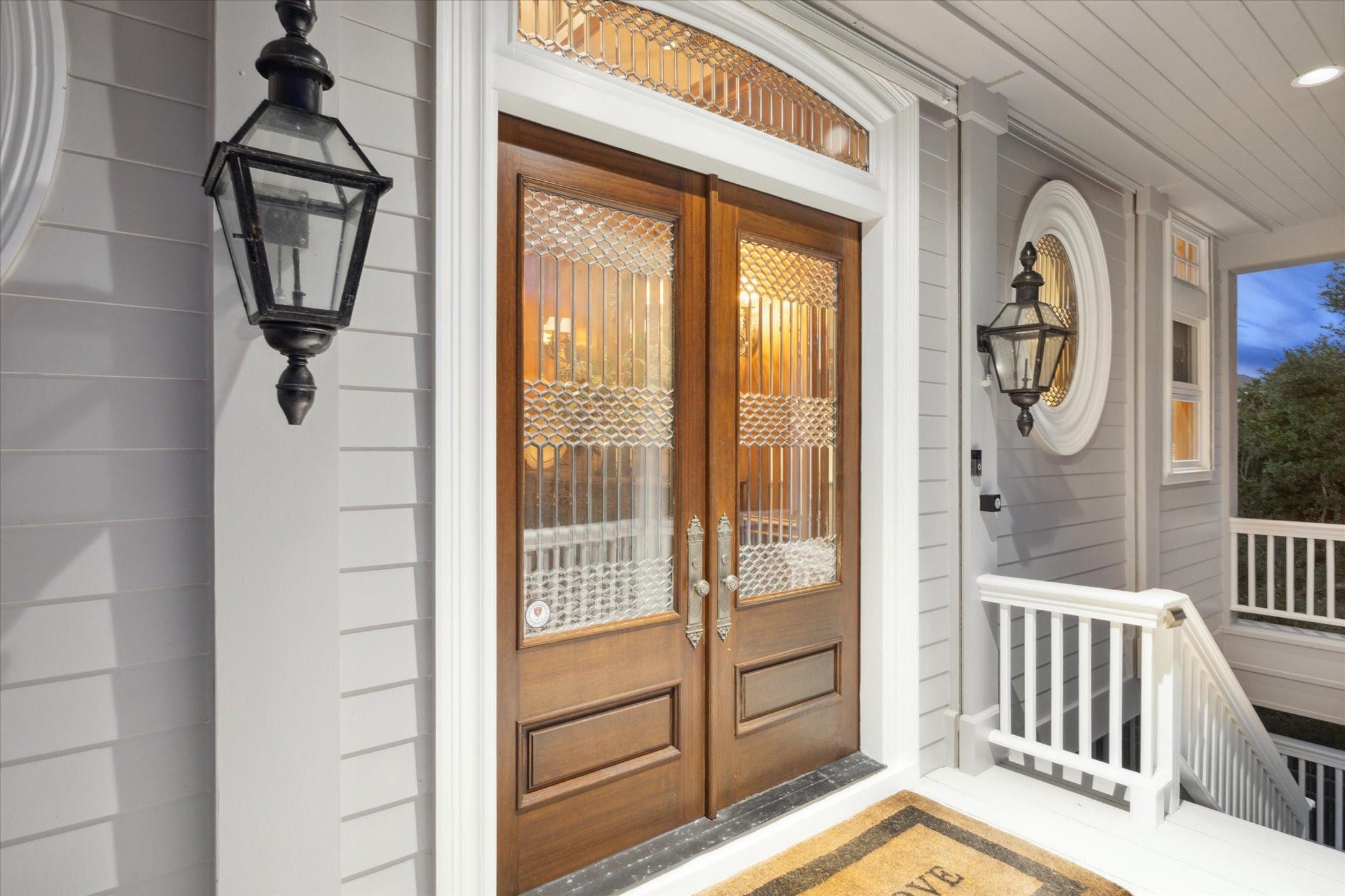 Image 3: Elegant leaded glass  front doors welcome you.
