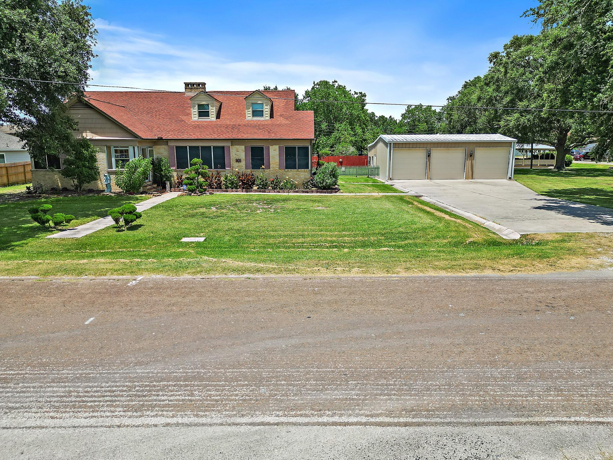 Image 2: This home sits on an oversized corner lot with a 3