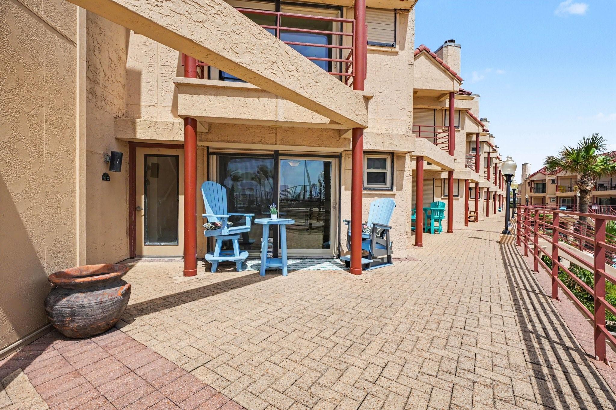Image 2: Patio area.  Hurricane shutter for security during