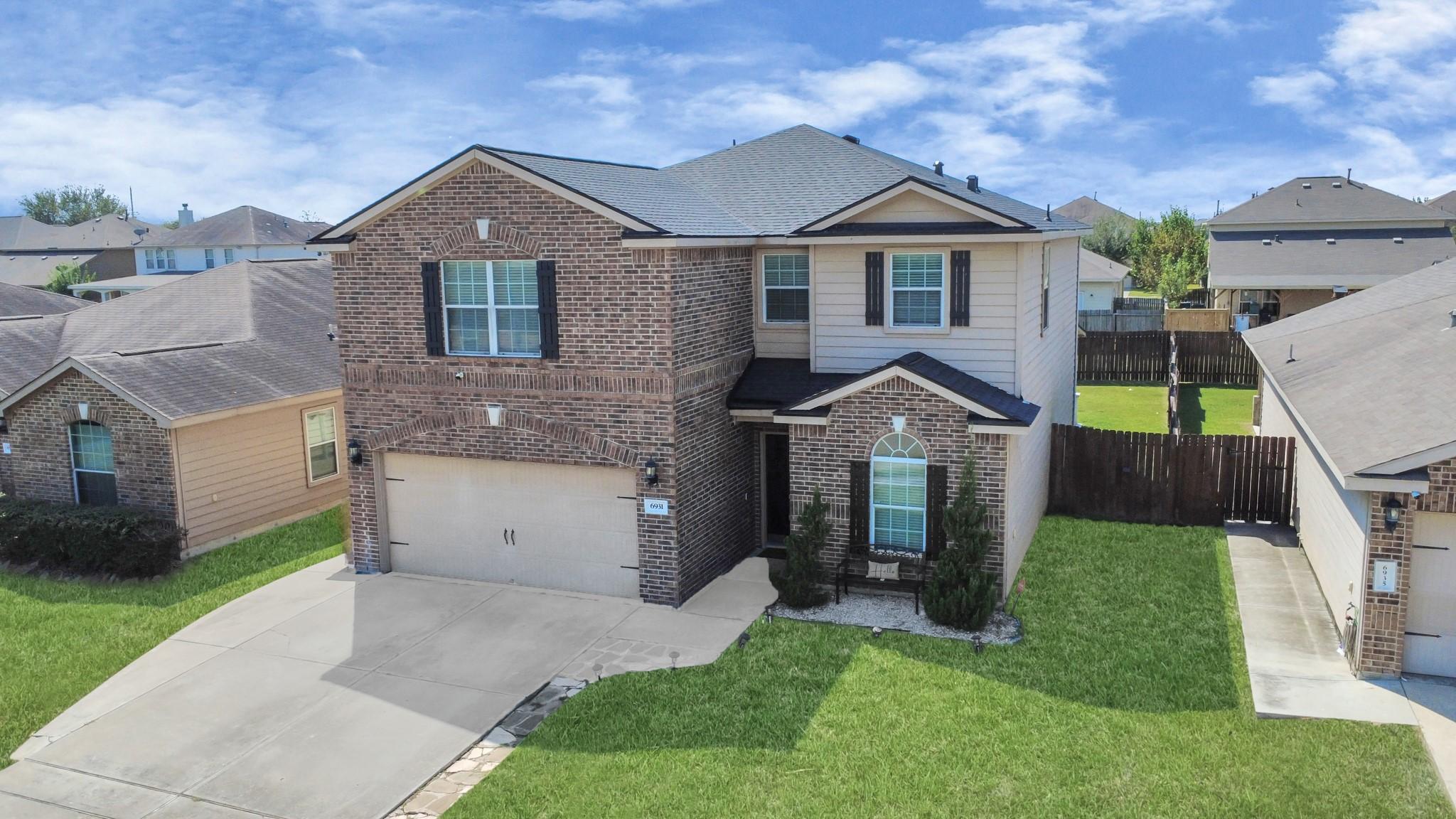 Image 3: Beautifully brick-front home with a 2-car garage a