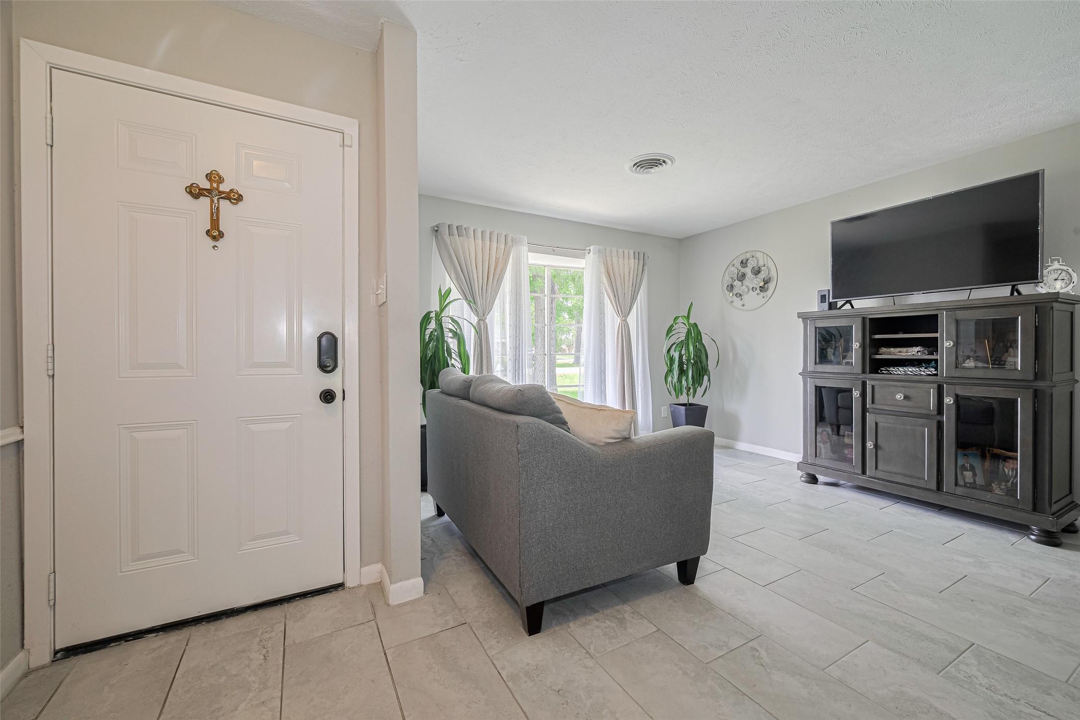 Image 4: this stunning 4-bedroom, 2-bath home offers 1,892