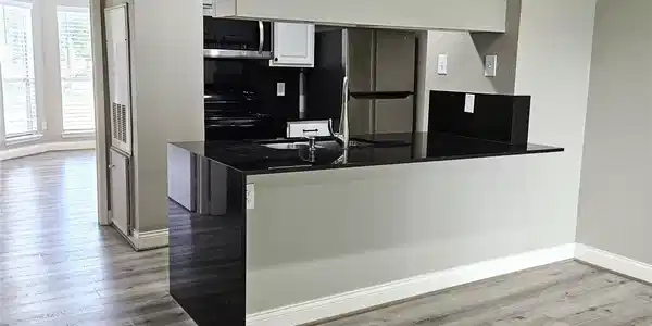 Image 2: Waterfall edge on the kitchen countertop with a ni