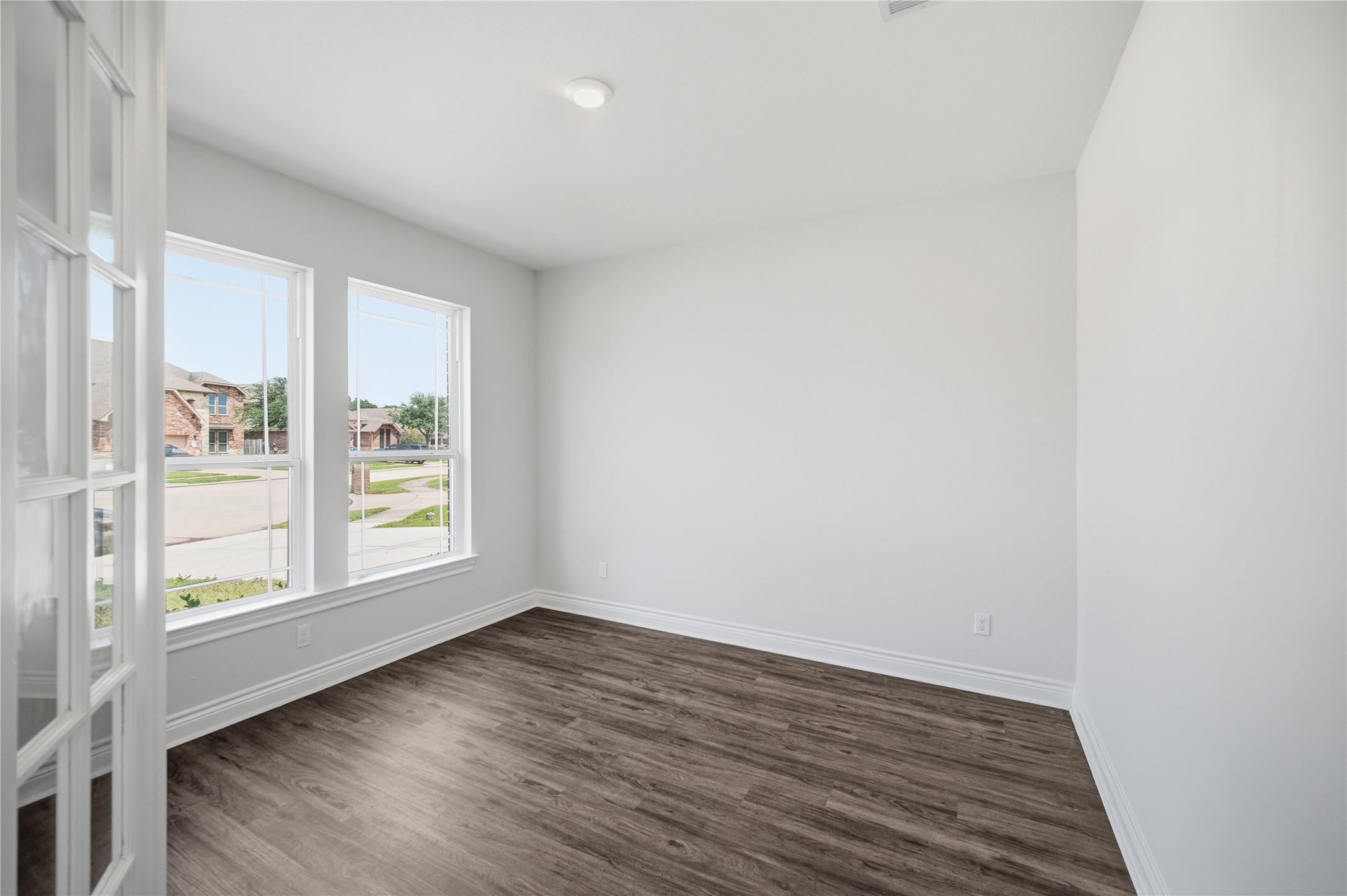 Image 4: The home office sits just off the entry, offering