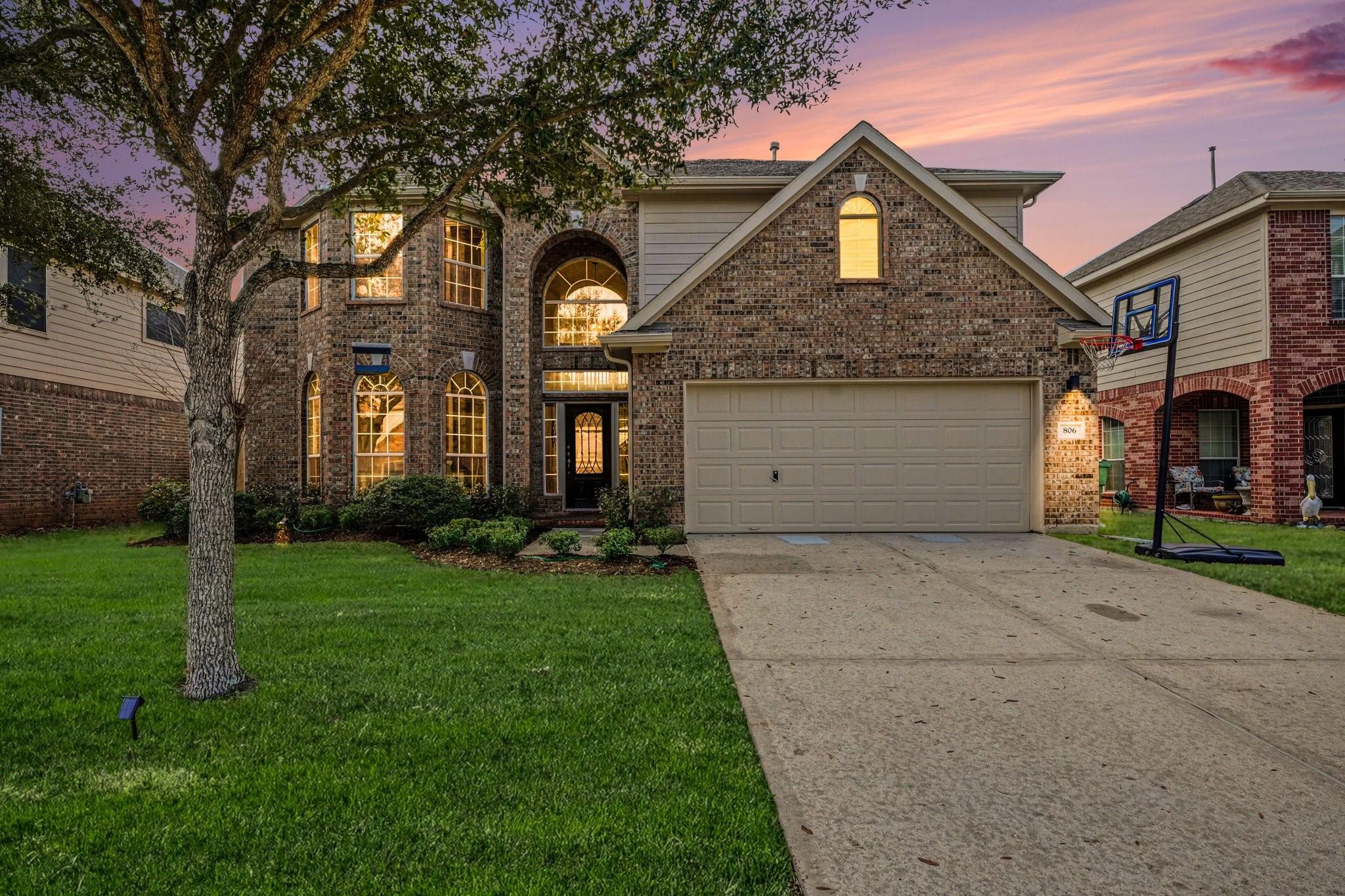 Image 1: FRONT ELEVATION AT DUSK.
