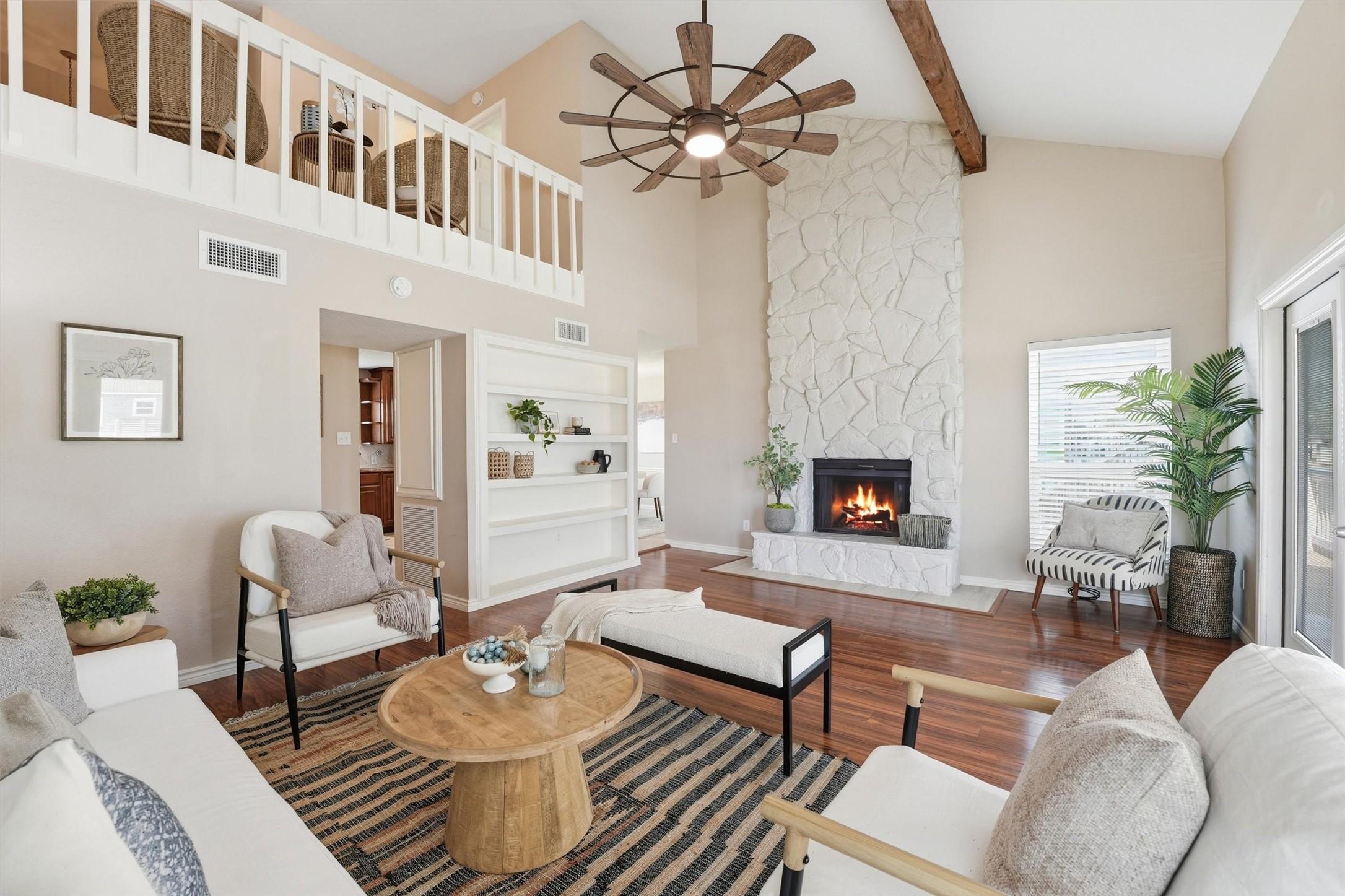 Image 1: The dramatic ceilings, exposed beam accents, and l