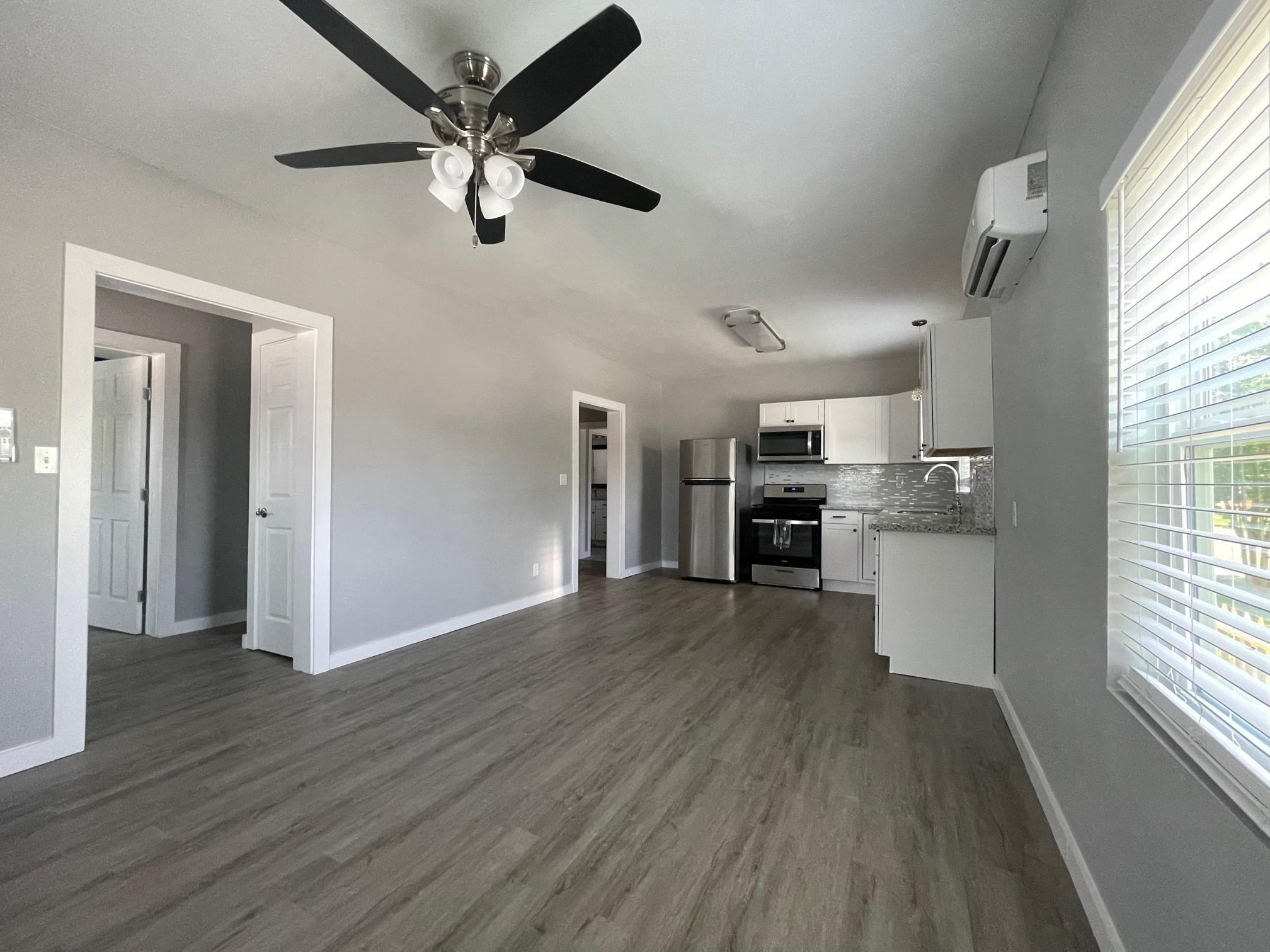 Image 2: Living Room Open to Kitchen
Step into an OPEN, AI