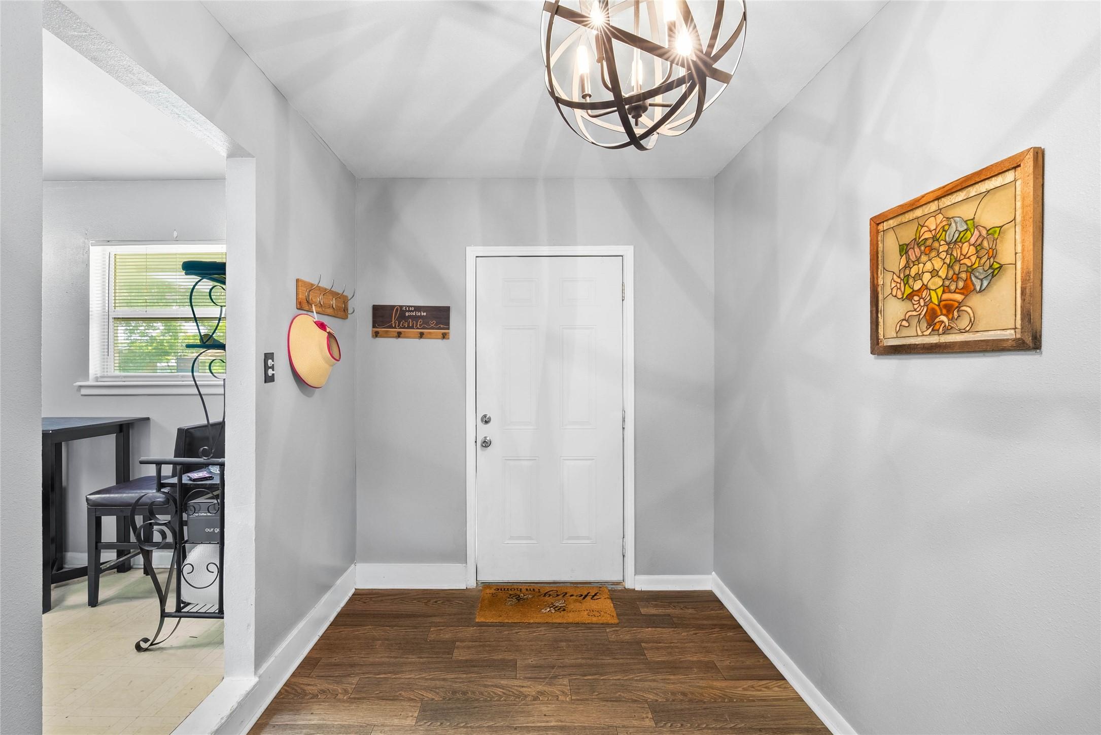 Image 3: Welcoming entryway and foyer featuring warm floori