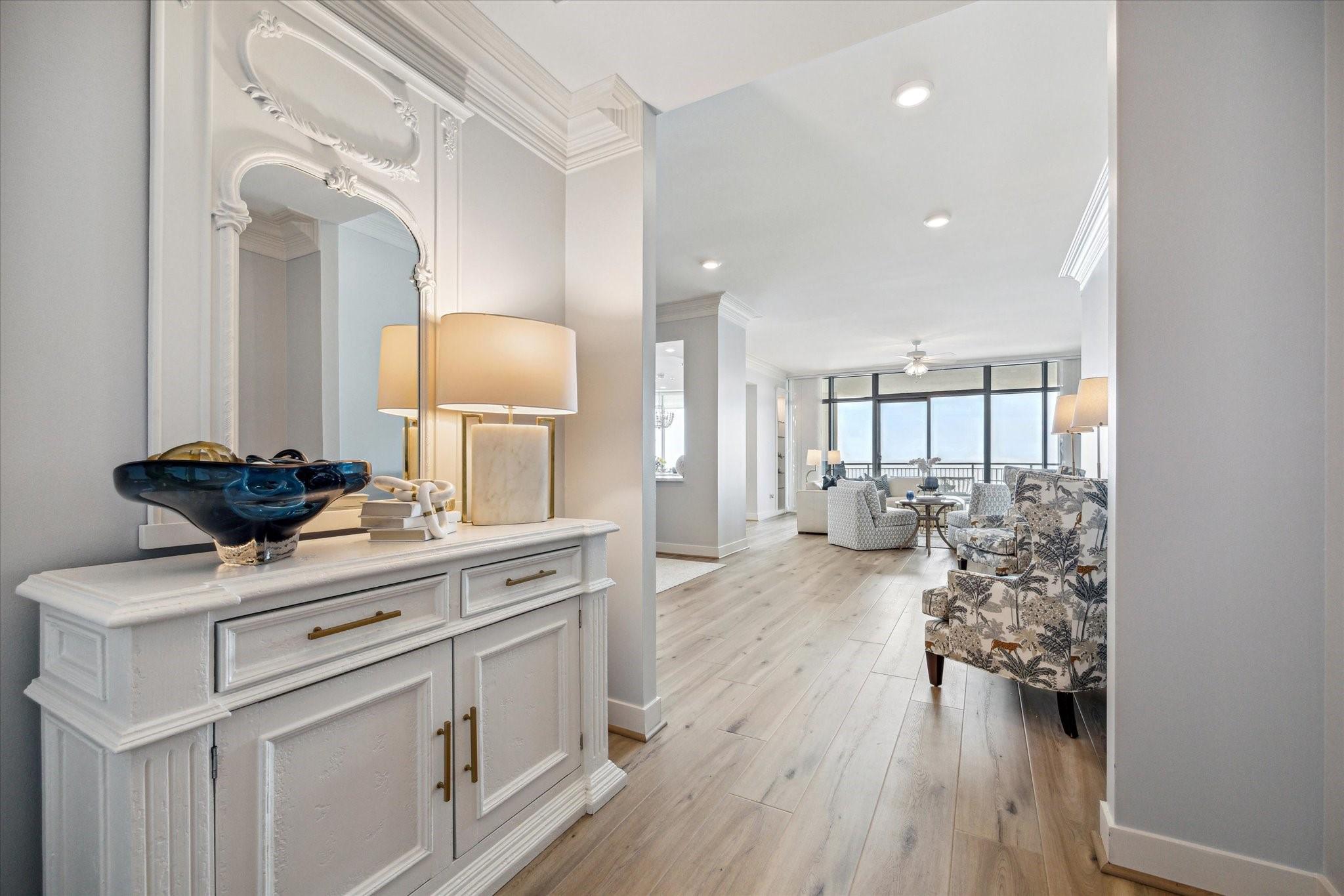 Image 3: The grand entry way leads to the living areas high
