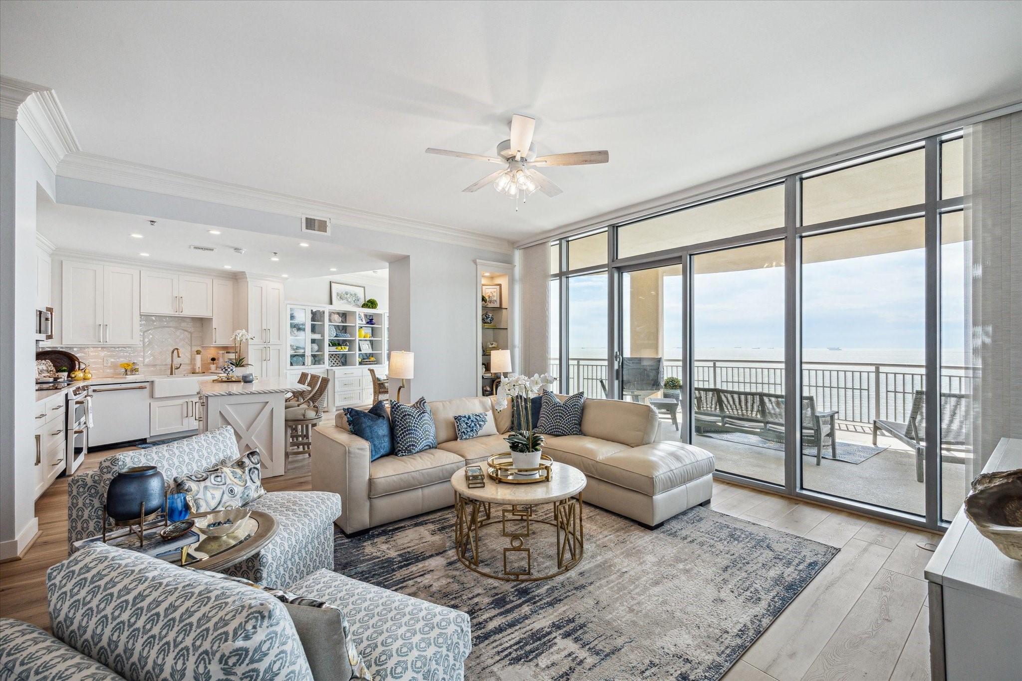 Image 4: Living area and kitchen flow together seamlessly,