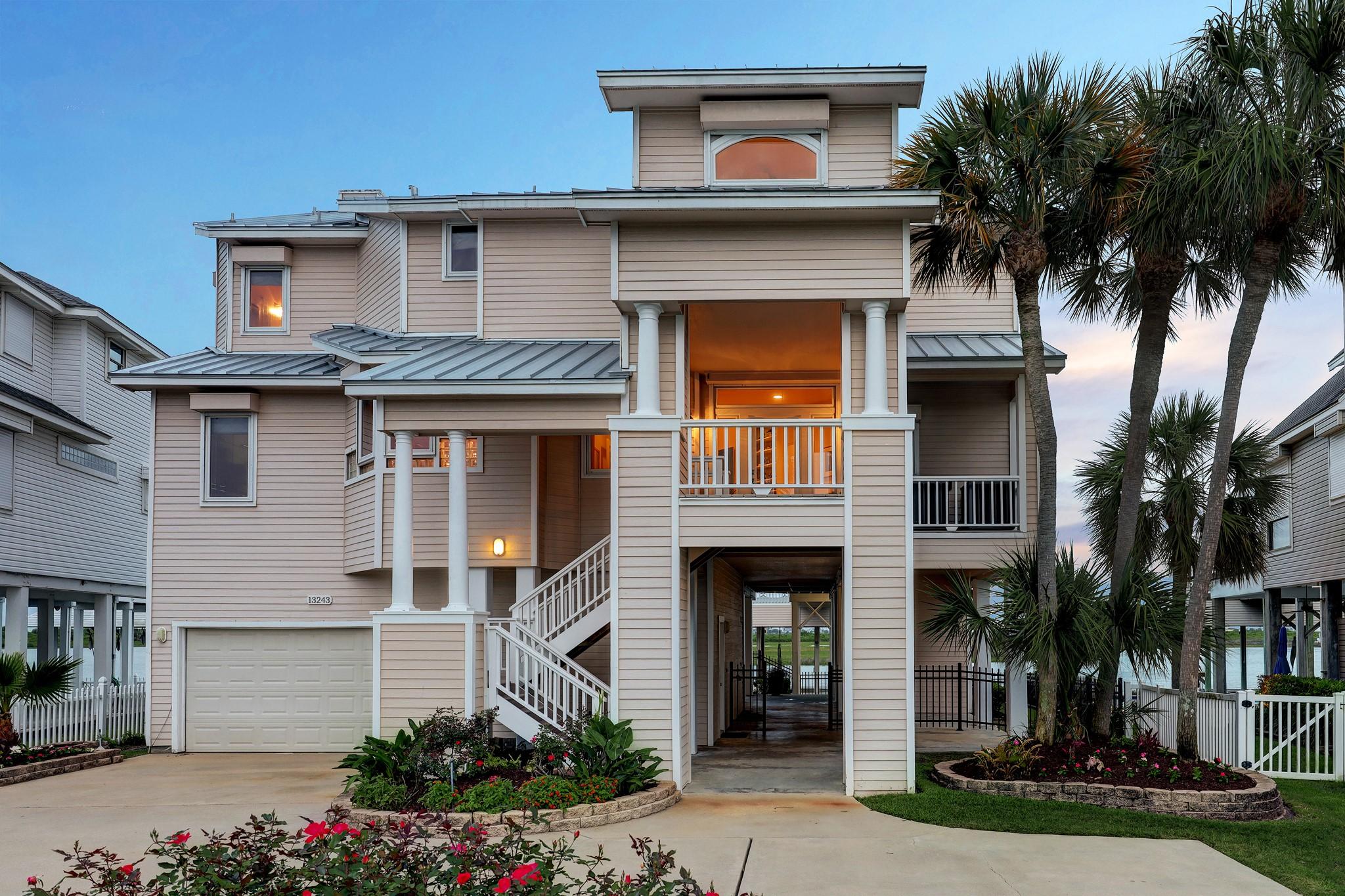 Image 2: This picturesque home features a metal roof, beaut