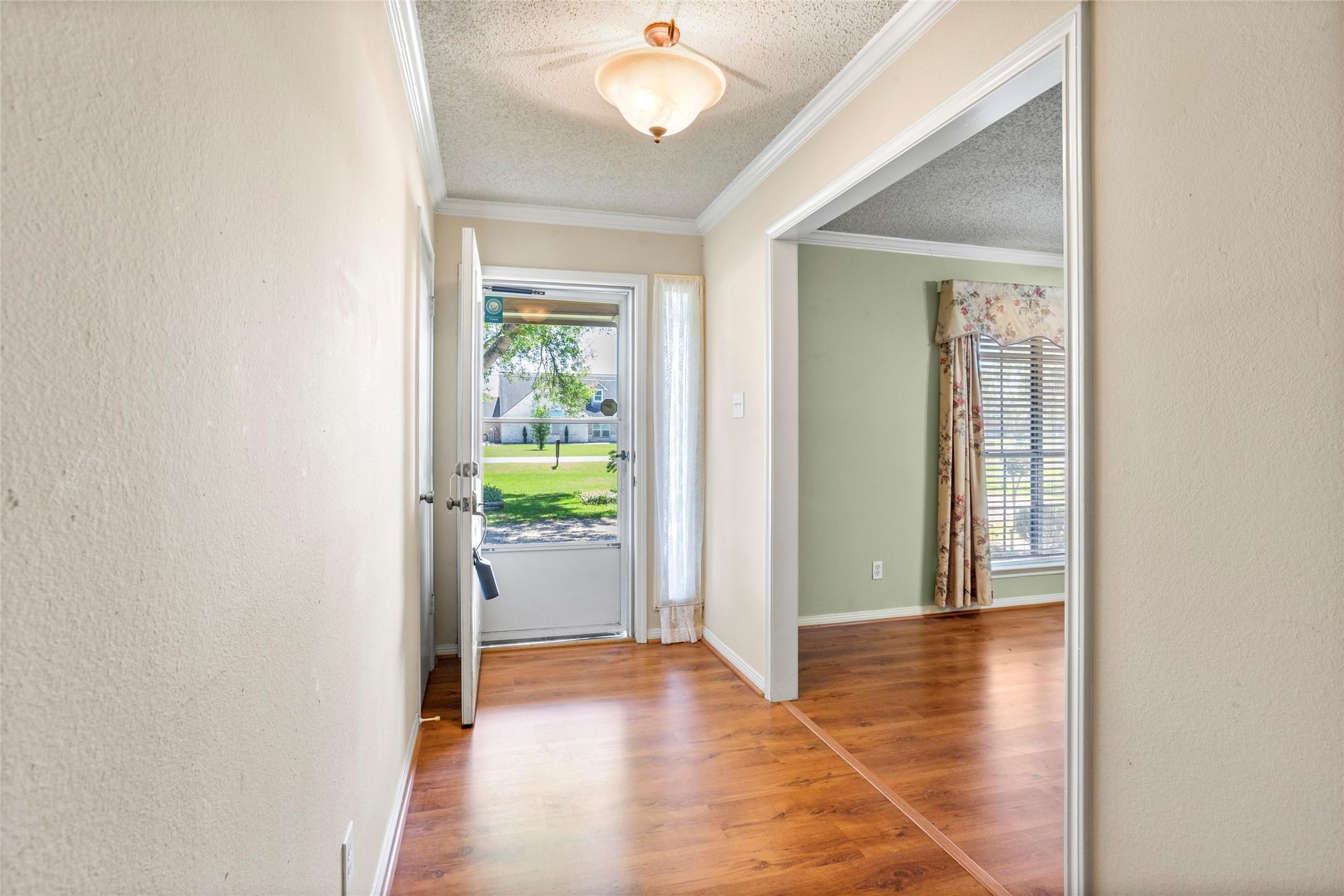 Image 4: Step into this welcoming front entry adorned with