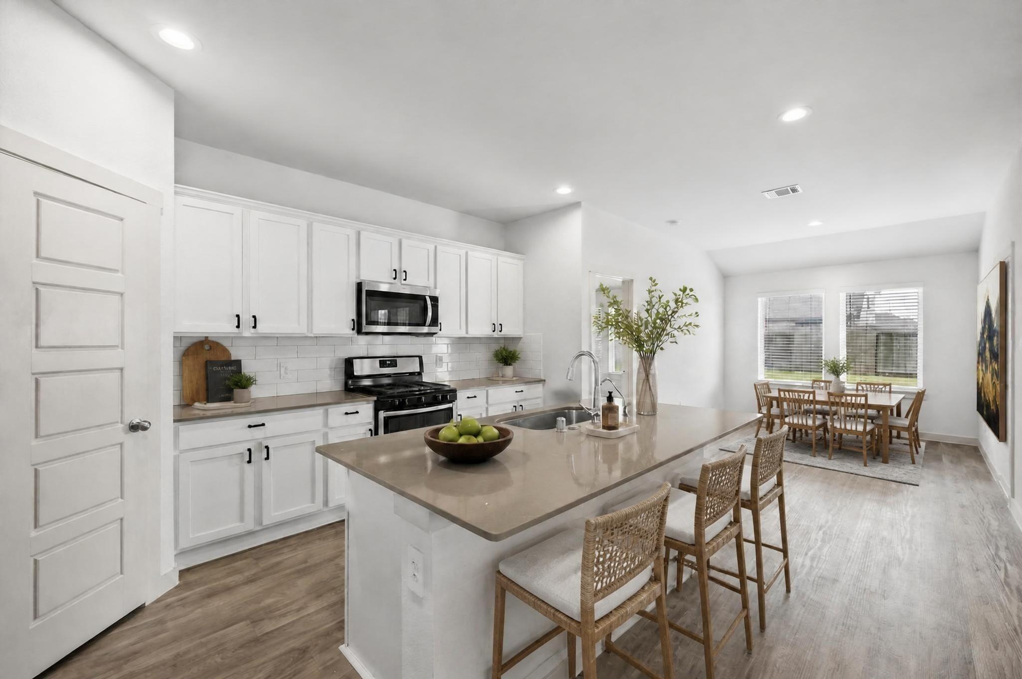 Image 2: The kitchen has been virtually staged to show the