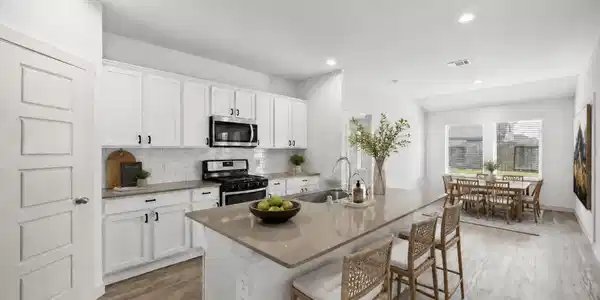 Image 2: The kitchen has been virtually staged to show the