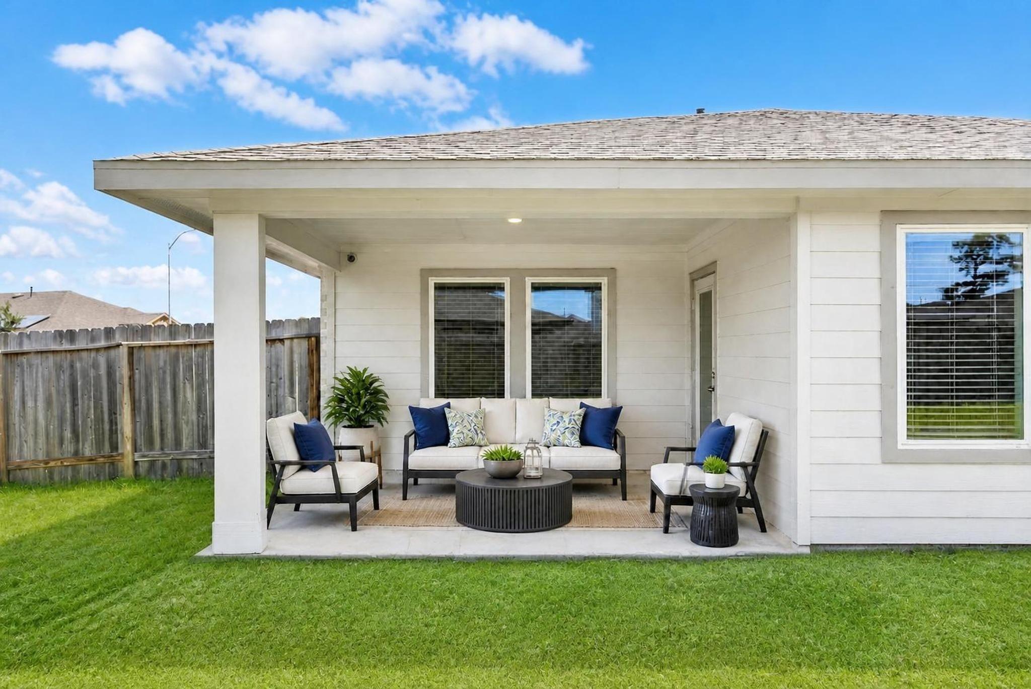 Image 4: Covered back patio. Virtually staged.