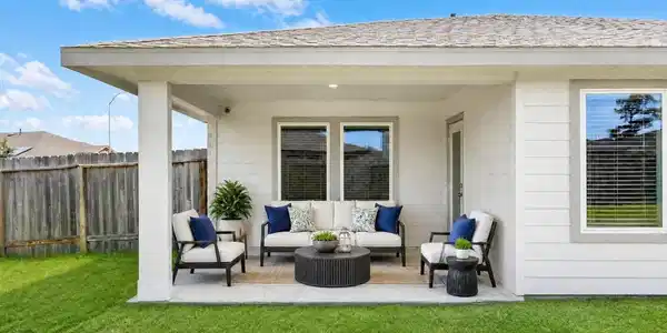Image 4: Covered back patio. Virtually staged.