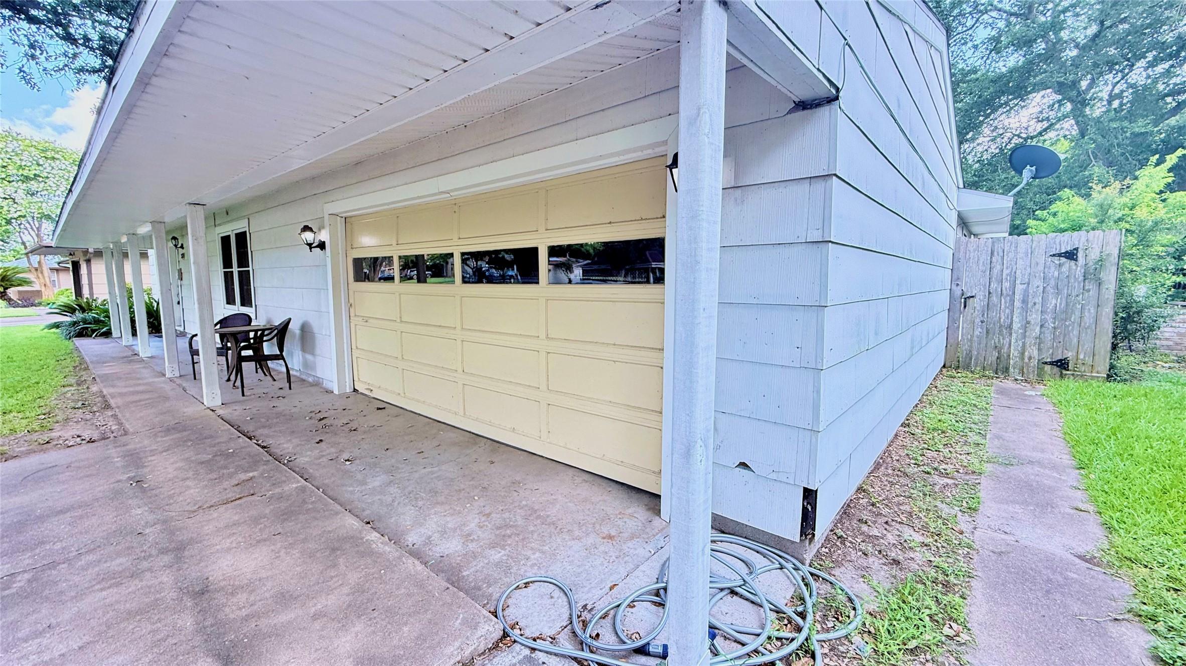 Image 3: Front porch runs the entire width of home. Two car