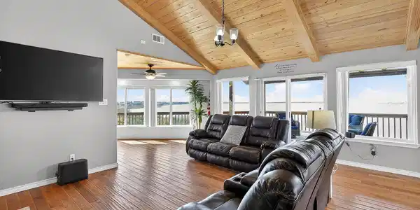 Image 4: Open family room with soaring ceilings and seamles