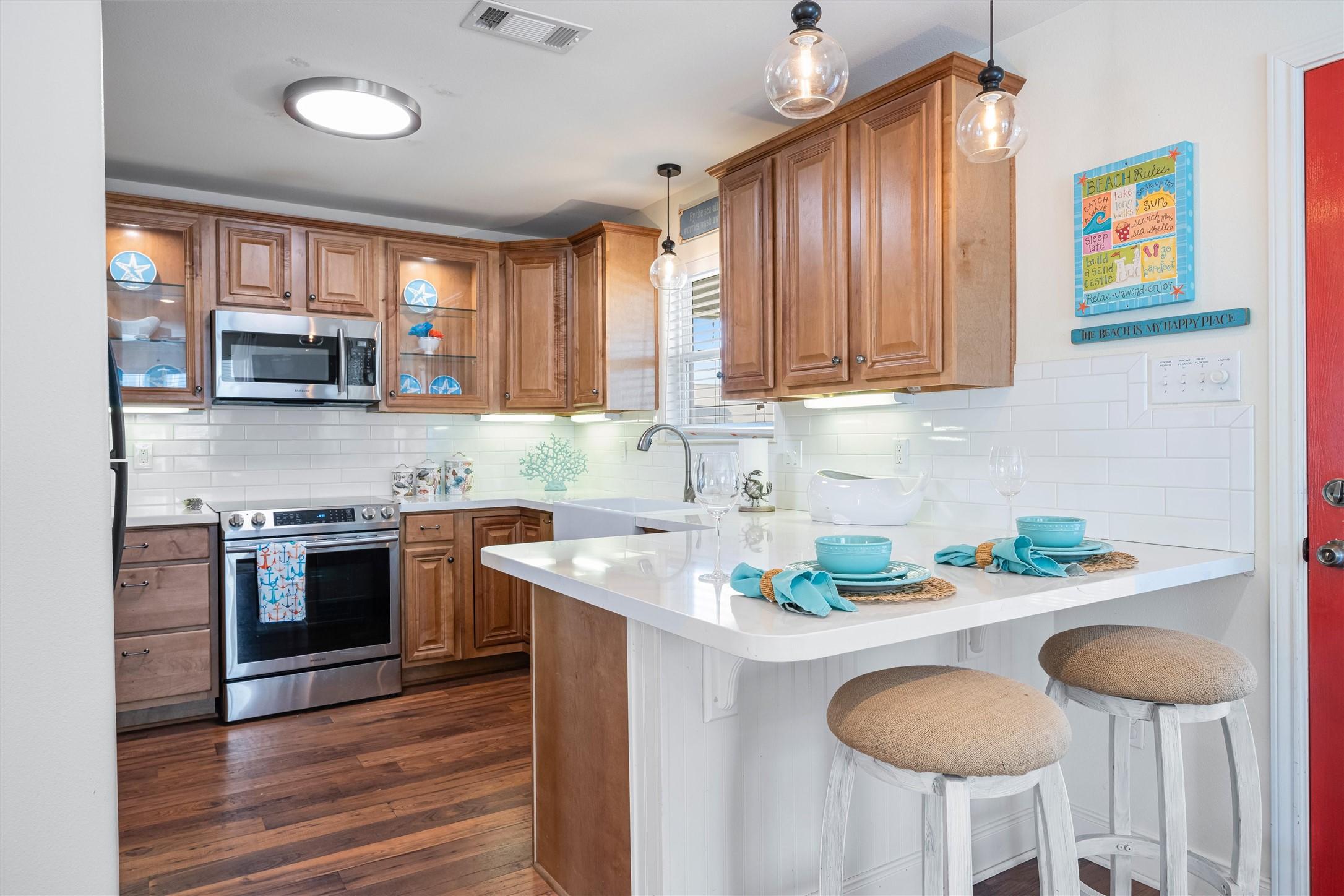Image 4: Kitchen was thoughtfully updated with quartz count