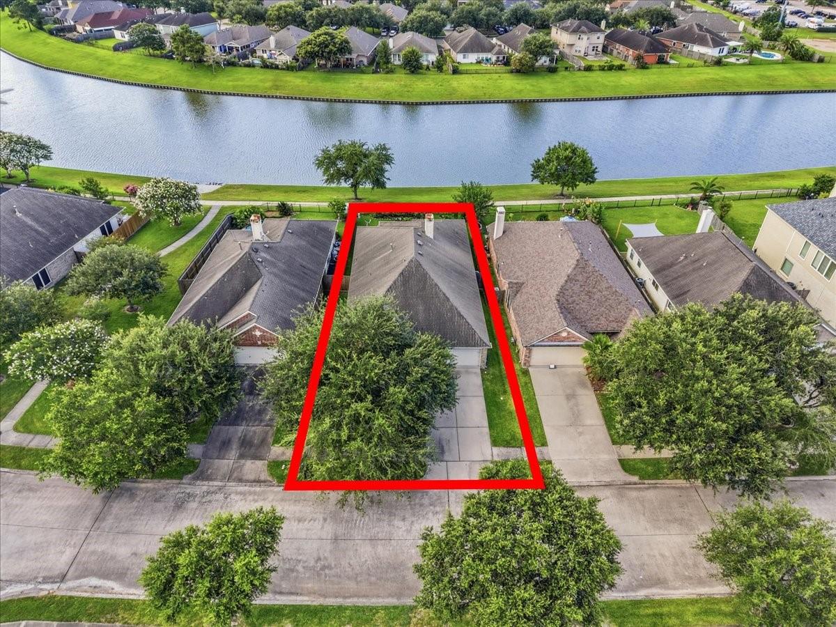 Image 2: Aerial perspective of the home perfectly situated