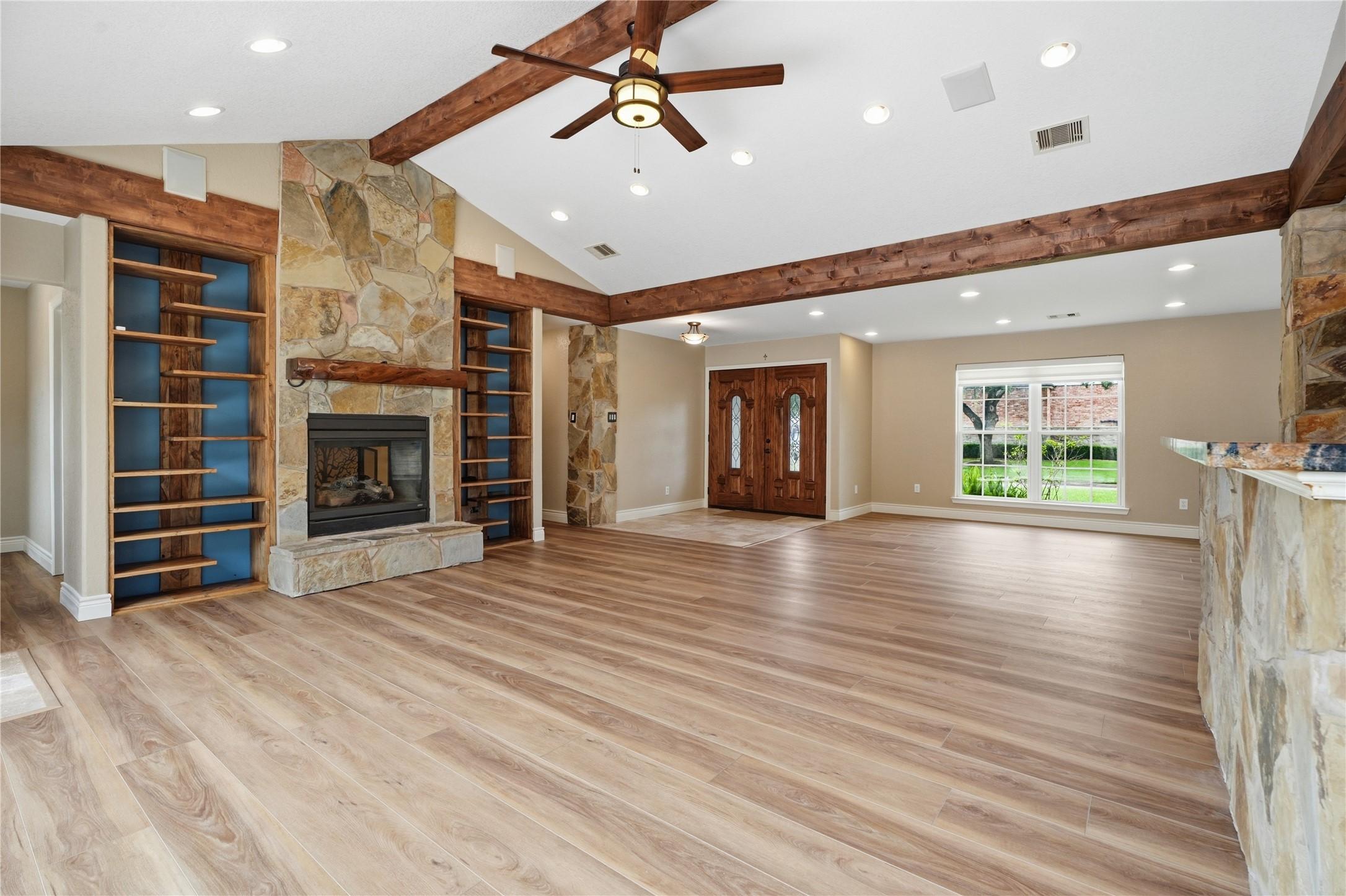 Image 3: Inviting family room features soaring beamed ceili